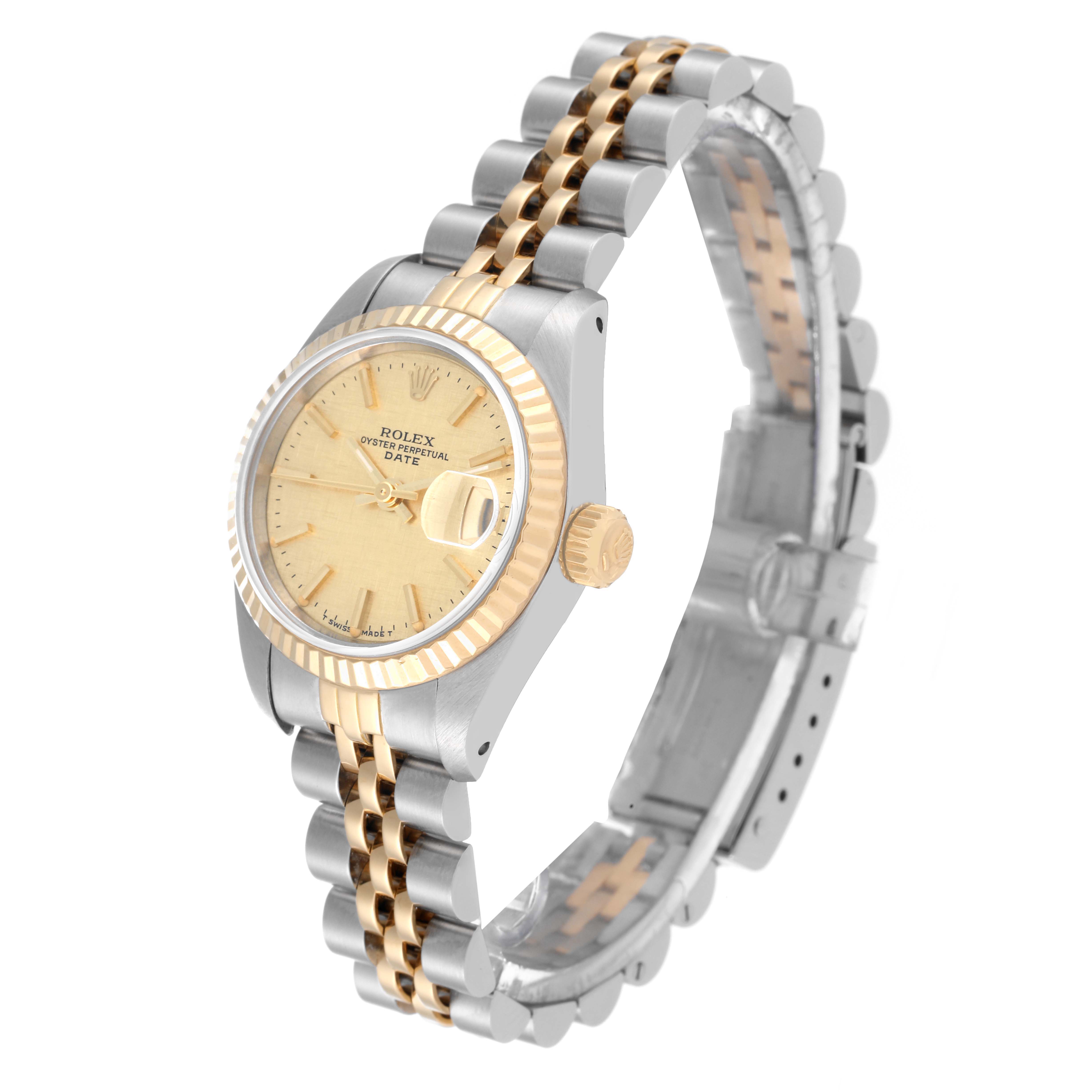 The image shows a Rolex Datejust 69173 Women's Steel and Gold (two tone) Champagne Dial 69173 Women's Steel and Gold (two tone) Champagne Dial watch at a three-quarter angle, highlighting its dial, fluted bezel, crown, and Jubilee bracelet.