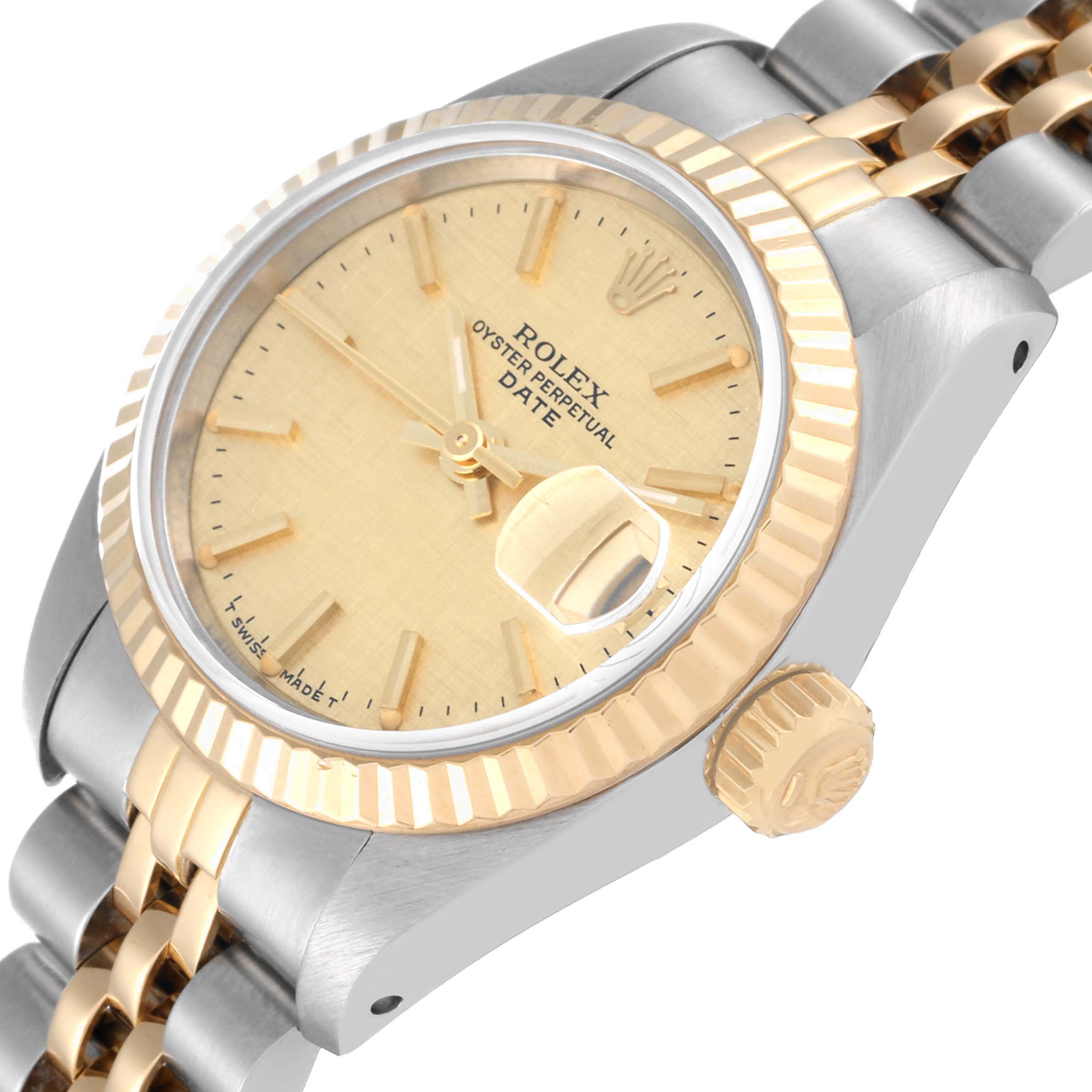 The image shows a close-up angle of the dial, crown, and part of the bracelet of the Rolex Datejust 69173 Women's Steel and Gold (two tone) Champagne Dial 69173 Women's Steel and Gold (two tone) Champagne Dial watch.