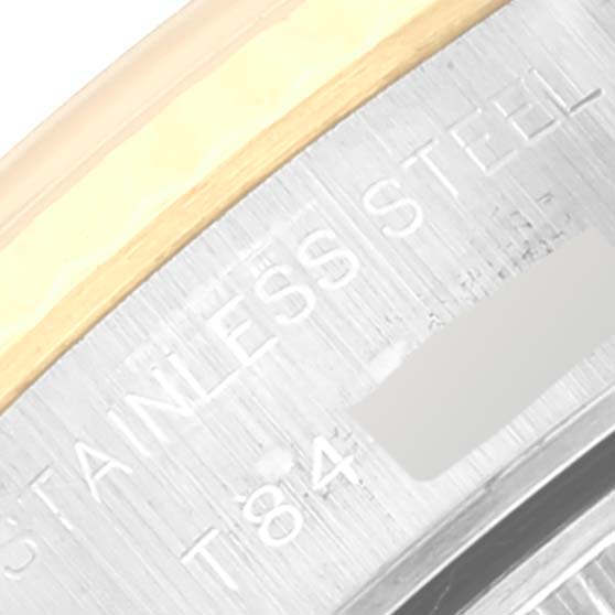 This close-up image shows the side view of the bezel and case of a Rolex Datejust 69173 Women's Steel and Gold (two tone) Champagne Dial 69173 Women's Steel and Gold (two tone) Champagne Dial, highlighting the stainless steel and gold finish.