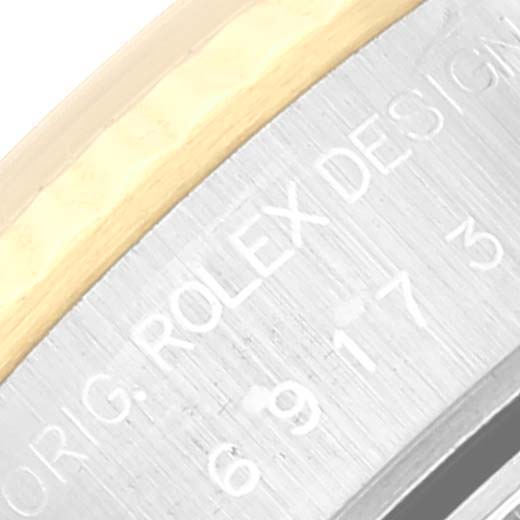 This close-up image shows the side of the case with engraving on the Rolex Datejust 69173 Women's Steel and Gold (two tone) Champagne Dial 69173 Women's Steel and Gold (two tone) Champagne Dial watch.