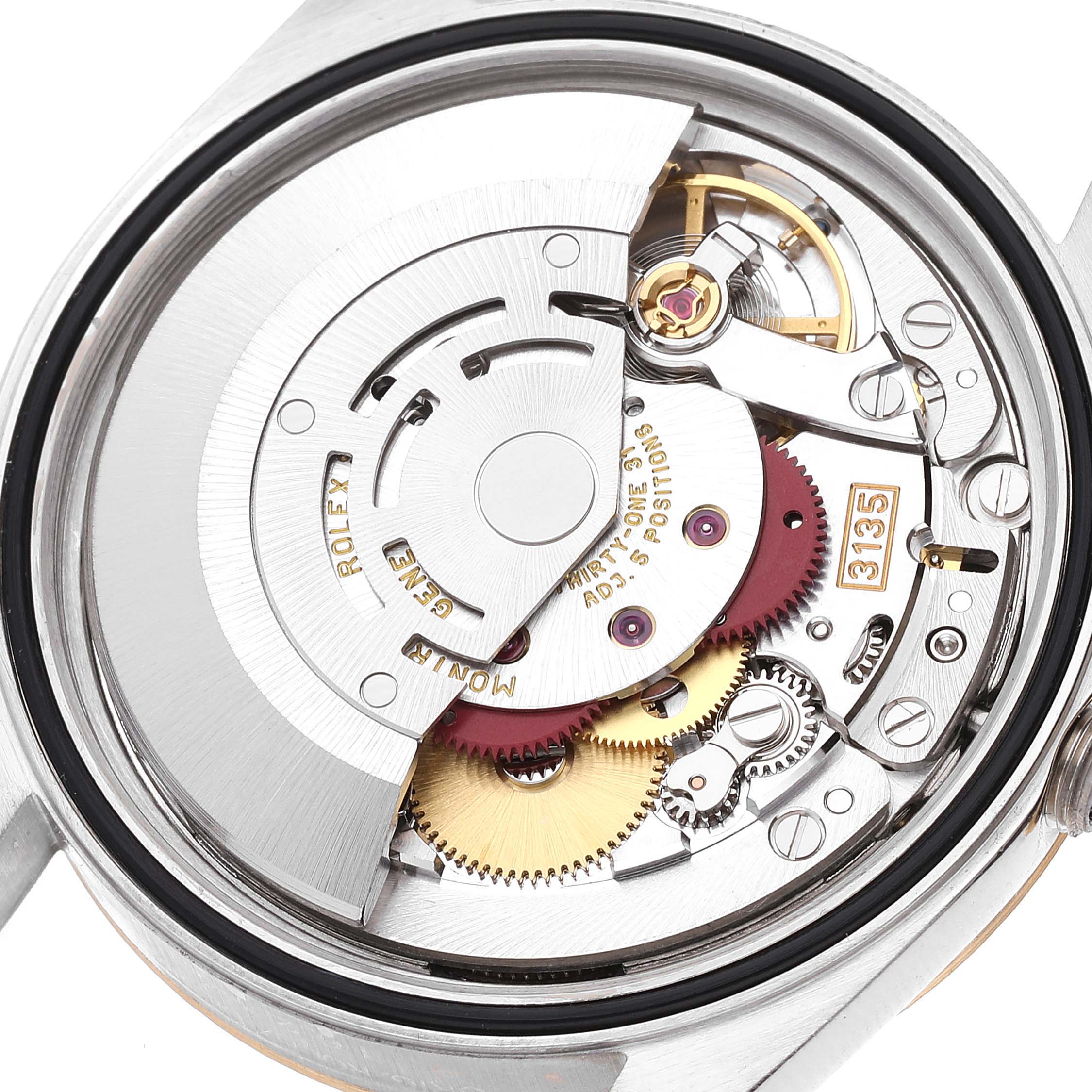 This image shows the internal mechanical movement of the Rolex Datejust 16233 Men's Steel and Gold (two tone) Champagne Dial 16233 Men's Steel and Gold (two tone) Champagne Dial watch from a back angle, highlighting gears and components.
