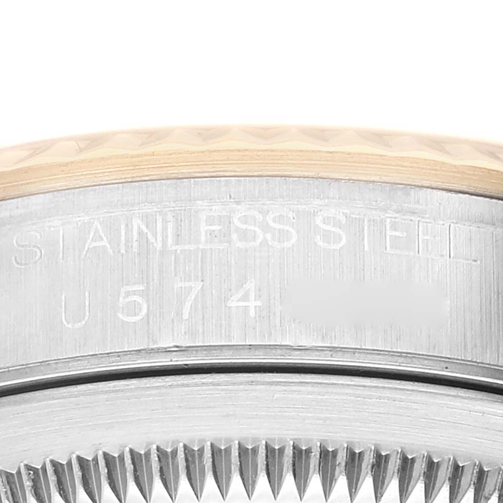 This image shows a close-up of the engraved stainless steel case back of a Rolex Datejust 16233 Men's Steel and Gold (two tone) Champagne Dial 16233 Men's Steel and Gold (two tone) Champagne Dial watch.