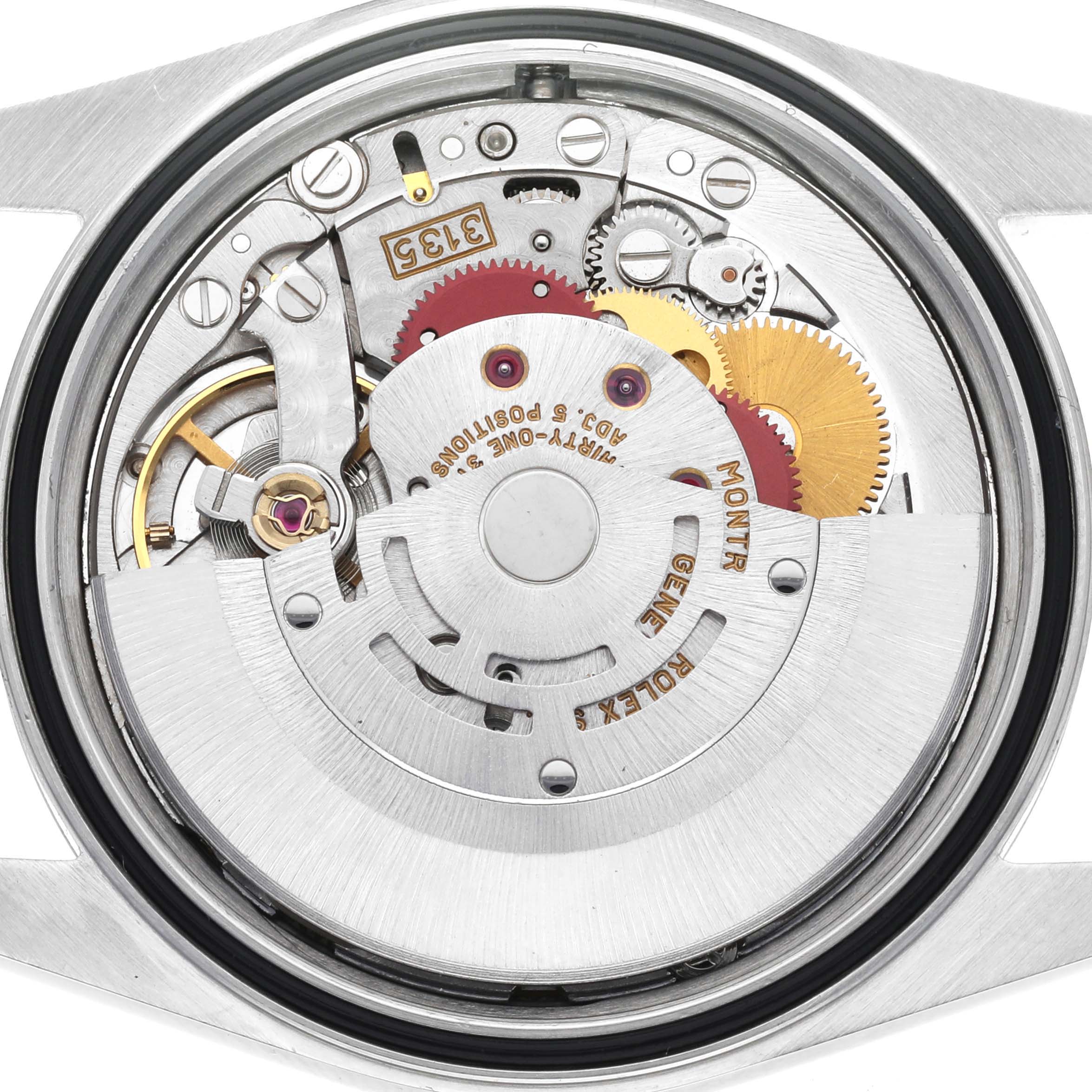 The image shows the movement of a Rolex Datejust 16233 Men's Steel and Gold (two tone) Champagne Dial 16233 Men's Steel and Gold (two tone) Champagne Dial watch from a back angle, highlighting gears and mechanical components.