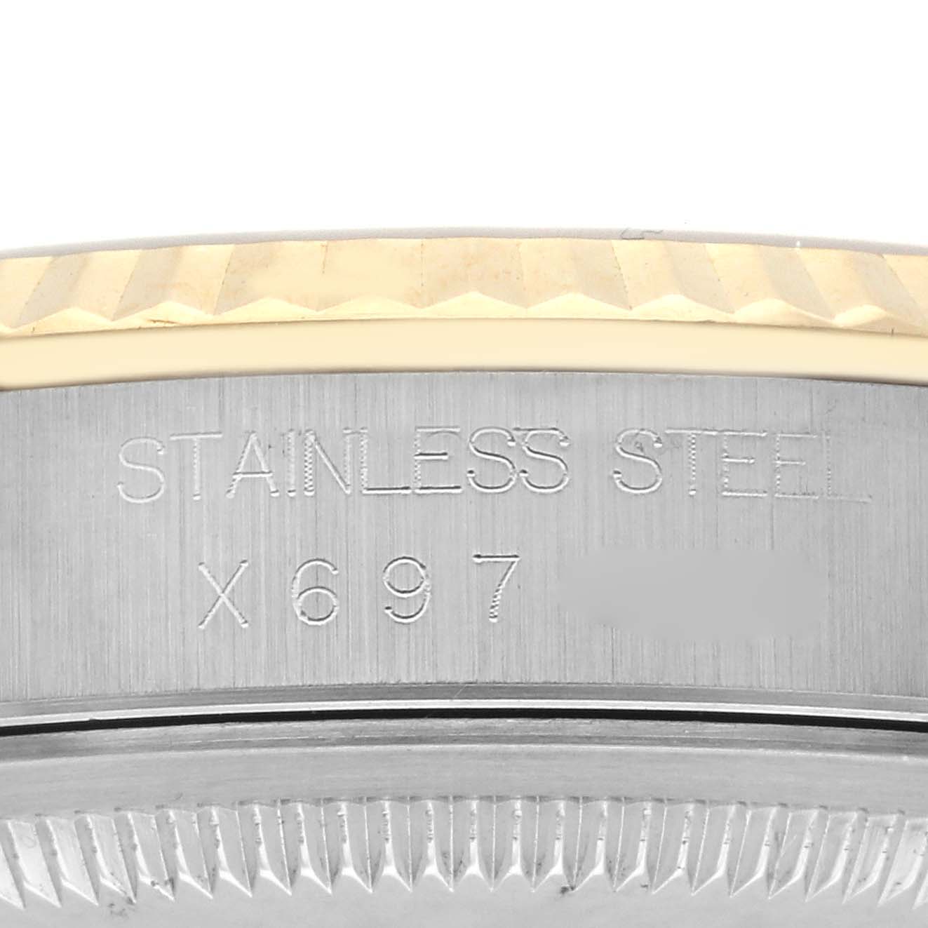This image shows the side engraving and bezel of a Rolex Datejust 16233 Men's Steel and Gold (two tone) Champagne Dial 16233 Men's Steel and Gold (two tone) Champagne Dial watch.