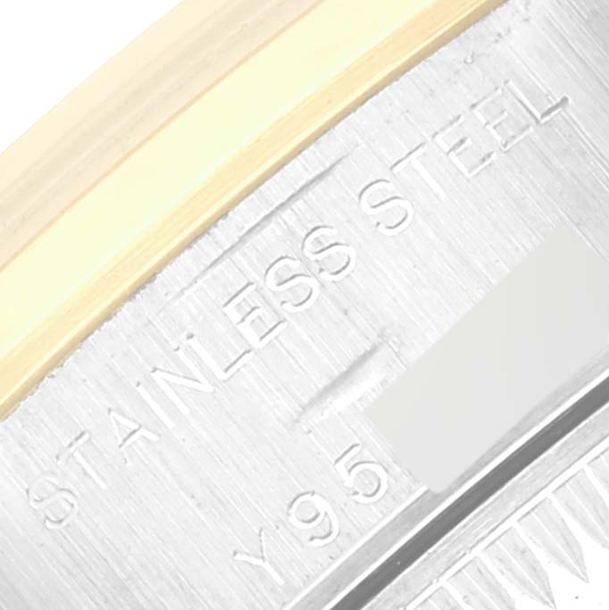 This close-up angle shows a partial view of the case and the engraving that says "Stainless Steel" on the Rolex Datejust 79163 Women's Steel and Gold (two tone) Mother of Pearl Dial 79163 Women's Steel and Gold (two tone) Mother of Pearl Dial watch.