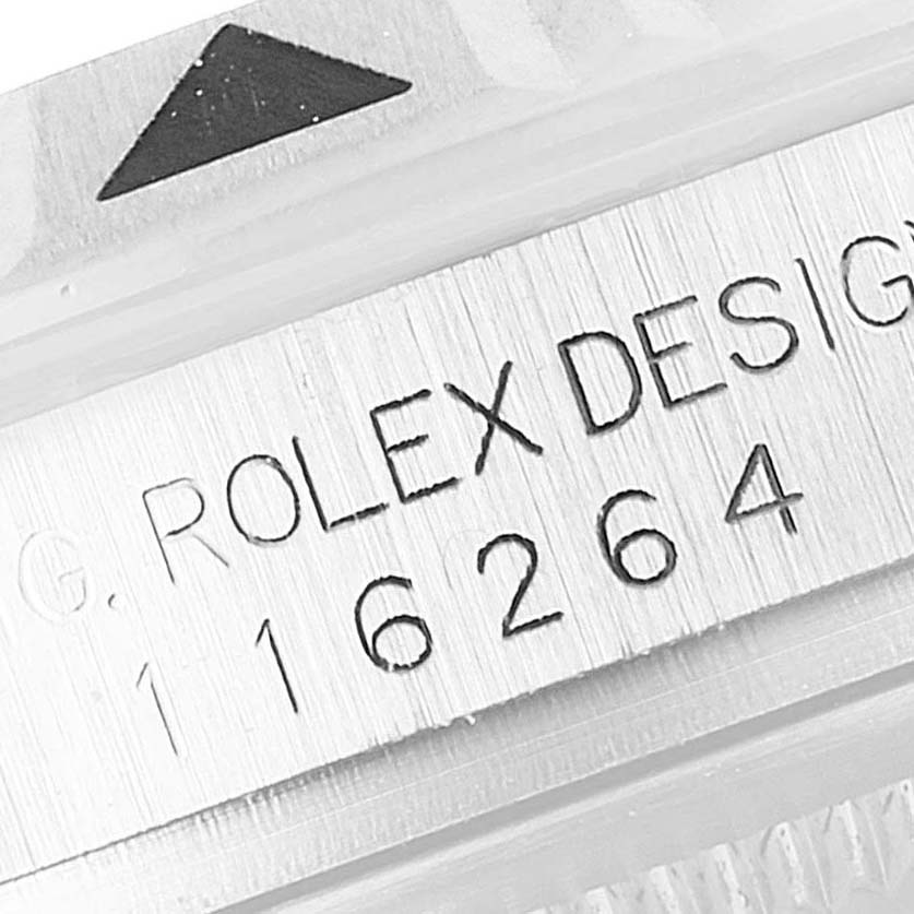 This close-up image of a Rolex Turn-o-Graph 116264 Men's Stainless Steel Blue Dial 116264 Men's Stainless Steel Blue Dial watch shows the watch's bezel and the engraved serial design number 116264.