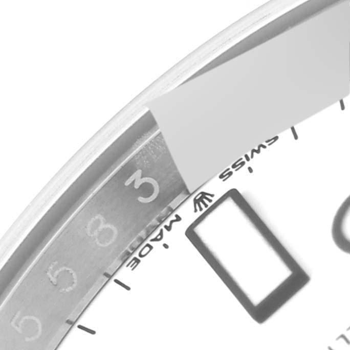 The image shows a close-up of the dial, bezel, and part of the rehaut of a Rolex Explorer 226570 Men
s Stainless Steel White Dial 226570 Men
s Stainless Steel White Dial watch.