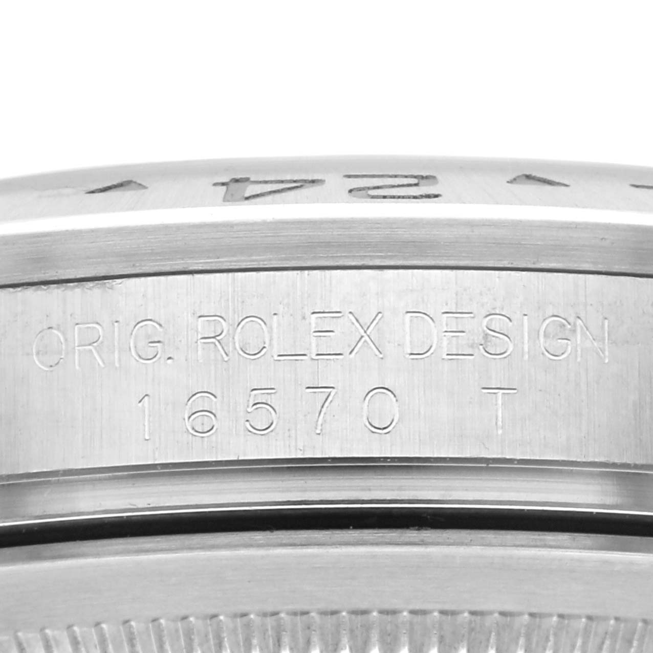 The image shows a close-up of the bezel and case side of the Rolex Explorer 16570 Men's Stainless Steel White Dial 16570 Men's Stainless Steel White Dial model, displaying the engraved "Orig. Rolex Design 16570 T".