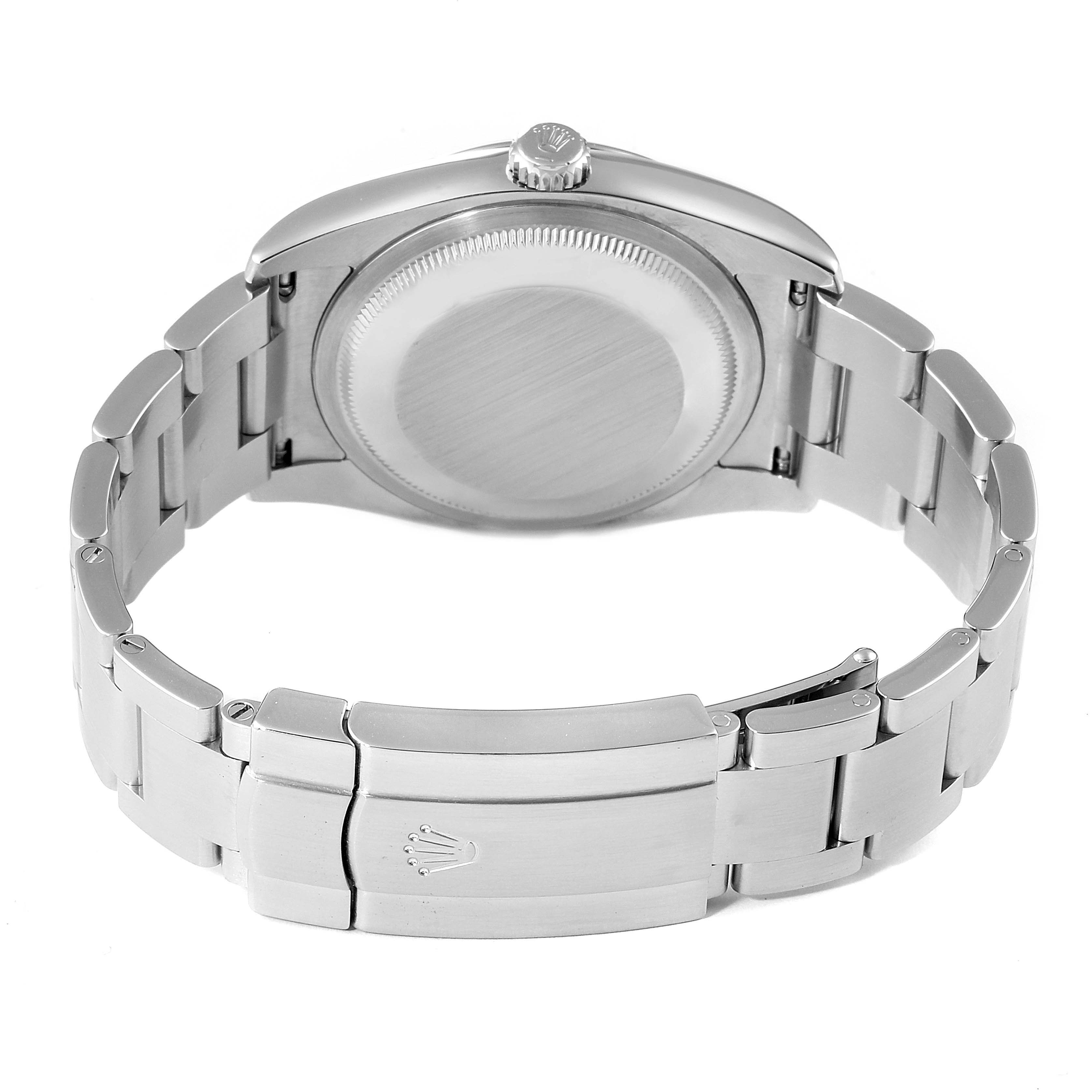 This image shows the back view of a Rolex Oyster Perpetual 116000 Men's Stainless Steel Champagne Dial 116000 Men's Stainless Steel Champagne Dial watch, highlighting the closed clasp and case back.