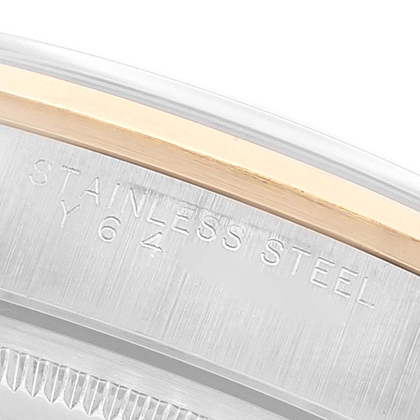 The image shows a close-up angle of the side of a Rolex Oyster Perpetual 14203 Men's Steel and Gold (two tone) Grey Dial 14203 Men's Steel and Gold (two tone) Grey Dial watch, highlighting the stainless steel and engravings.