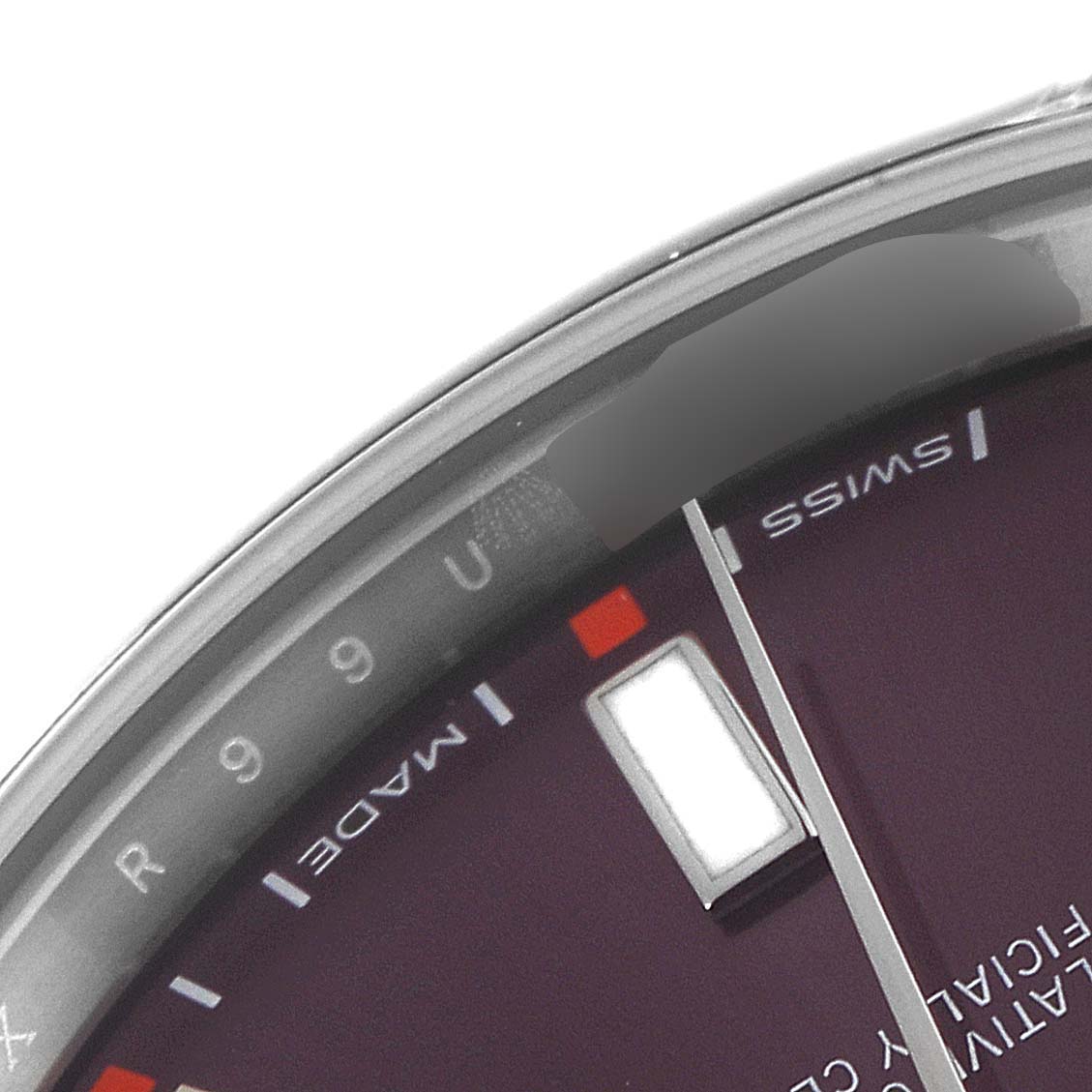 This image shows a close-up of the dial and bezel of a Rolex Oyster Perpetual 114300 Men's Stainless Steel Burgundy Dial 114300 Men's Stainless Steel Burgundy Dial watch.