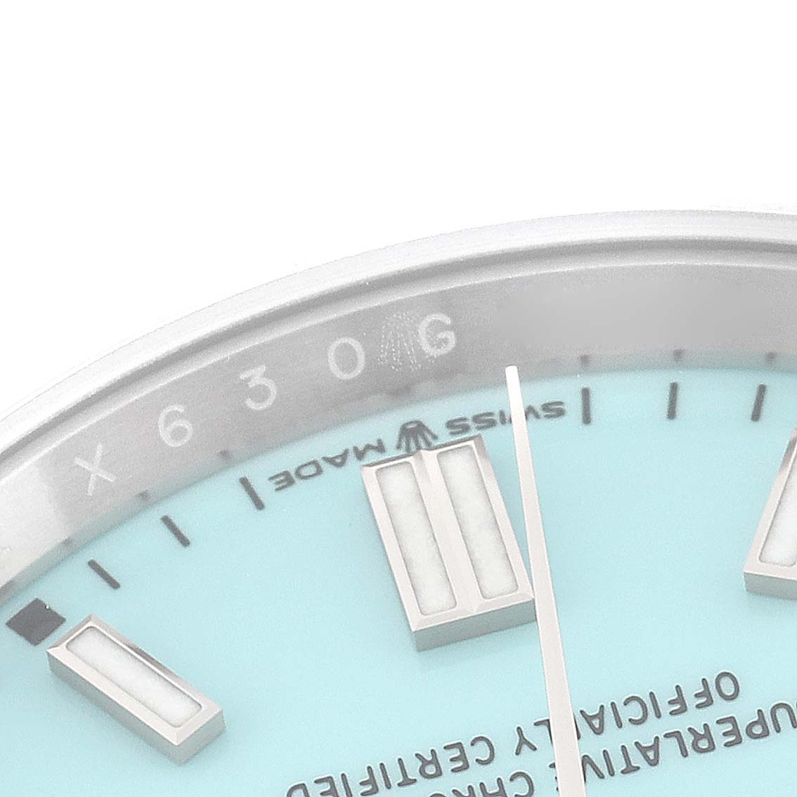 This image shows a close-up of the dial and part of the bezel of a Rolex Oyster Perpetual 126000 Men
s Stainless Steel Blue Dial 126000 Men
s Stainless Steel Blue Dial watch.