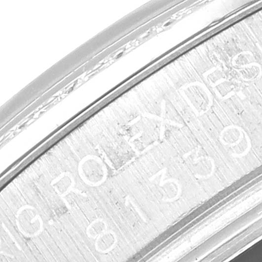 The image shows a close-up angle of the bezel and part of the engraved text on a Rolex Pearlmaster 81339 Women's White Gold Mother of Pearl Dial 81339 Women's White Gold Mother of Pearl Dial watch.