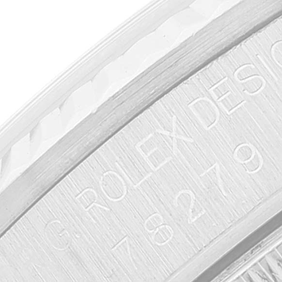 This image shows an up-close view of the engraved branding and serial number on the side of a Rolex President 78279 Women's White Gold Blue Dial 78279 Women's White Gold Blue Dial watch.