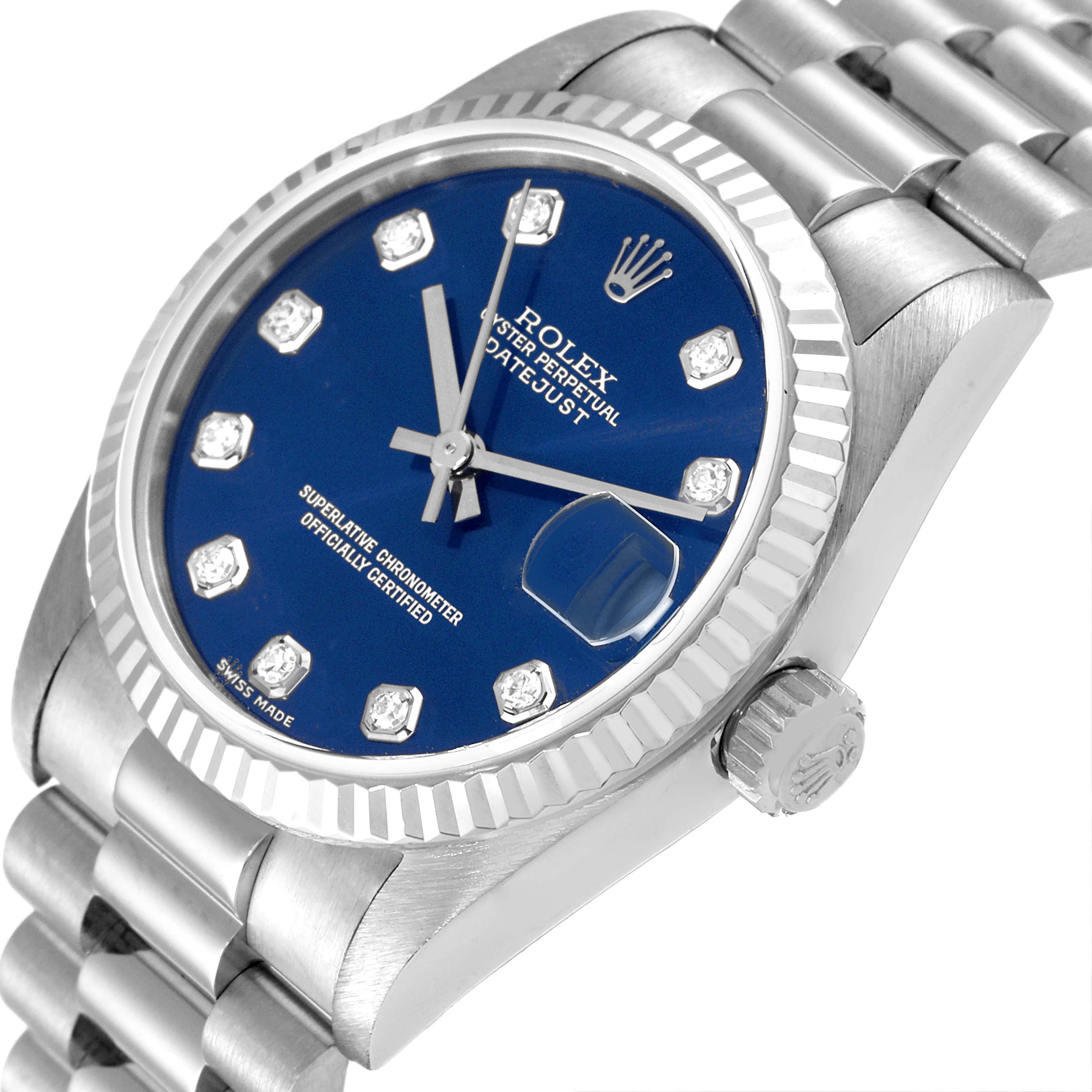 The image shows a close-up angle of the Rolex President 78279 Women's White Gold Blue Dial 78279 Women's White Gold Blue Dial Datejust watch, highlighting its blue dial, fluted bezel, and crown.