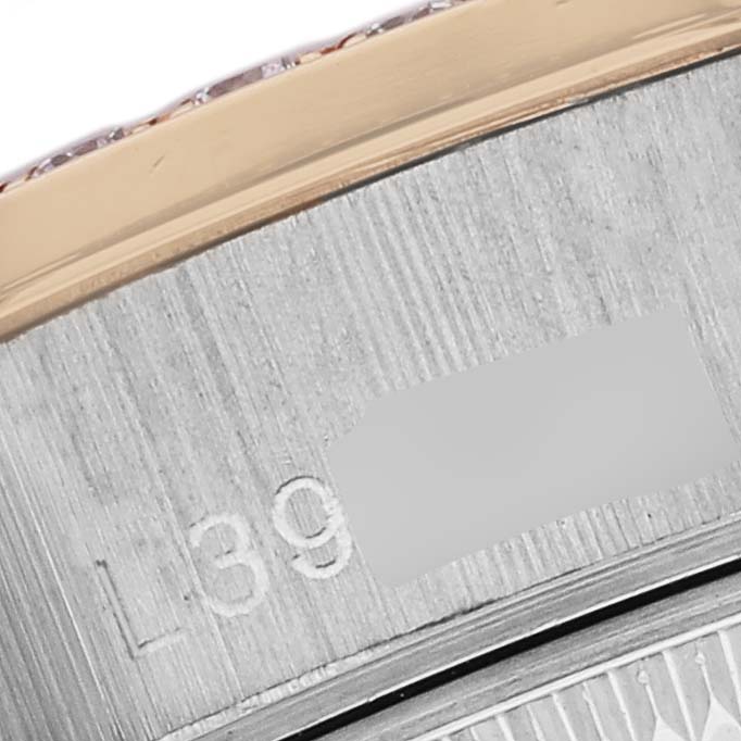 The image shows a close-up of the side engraving on the bezel and case of a Rolex President 69139 Women
s White Gold Champagne Dial 69139 Women
s White Gold Champagne Dial watch.