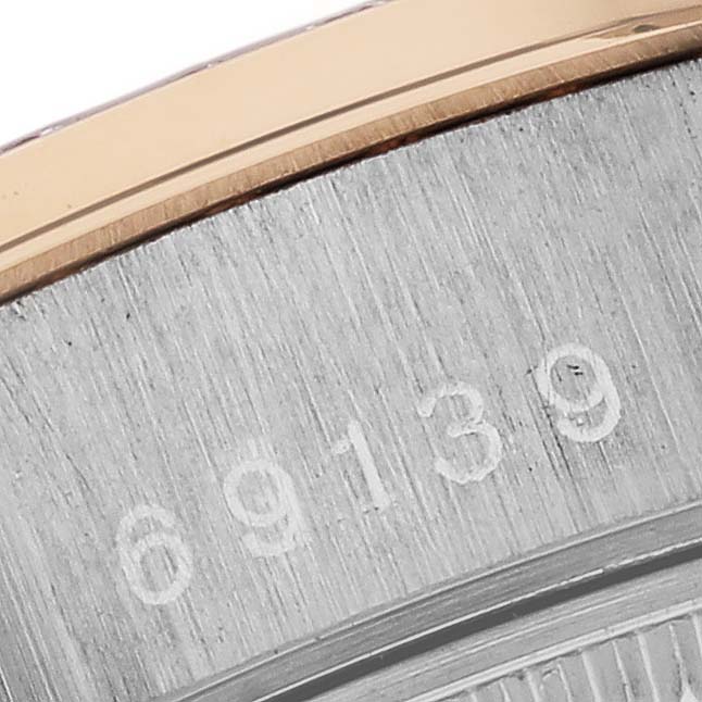 The image shows a close-up of the serial number engraving on the side of a Rolex President 69139 Women
s White Gold Champagne Dial 69139 Women
s White Gold Champagne Dial watch case.