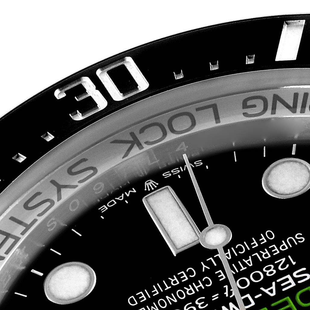 The image shows a close-up of the dial and bezel of a Rolex Sea-Dweller 126660 Men
s Stainless Steel Black Dial 126660 Men
s Stainless Steel Black Dial watch, highlighting the 30-minute mark and text details.