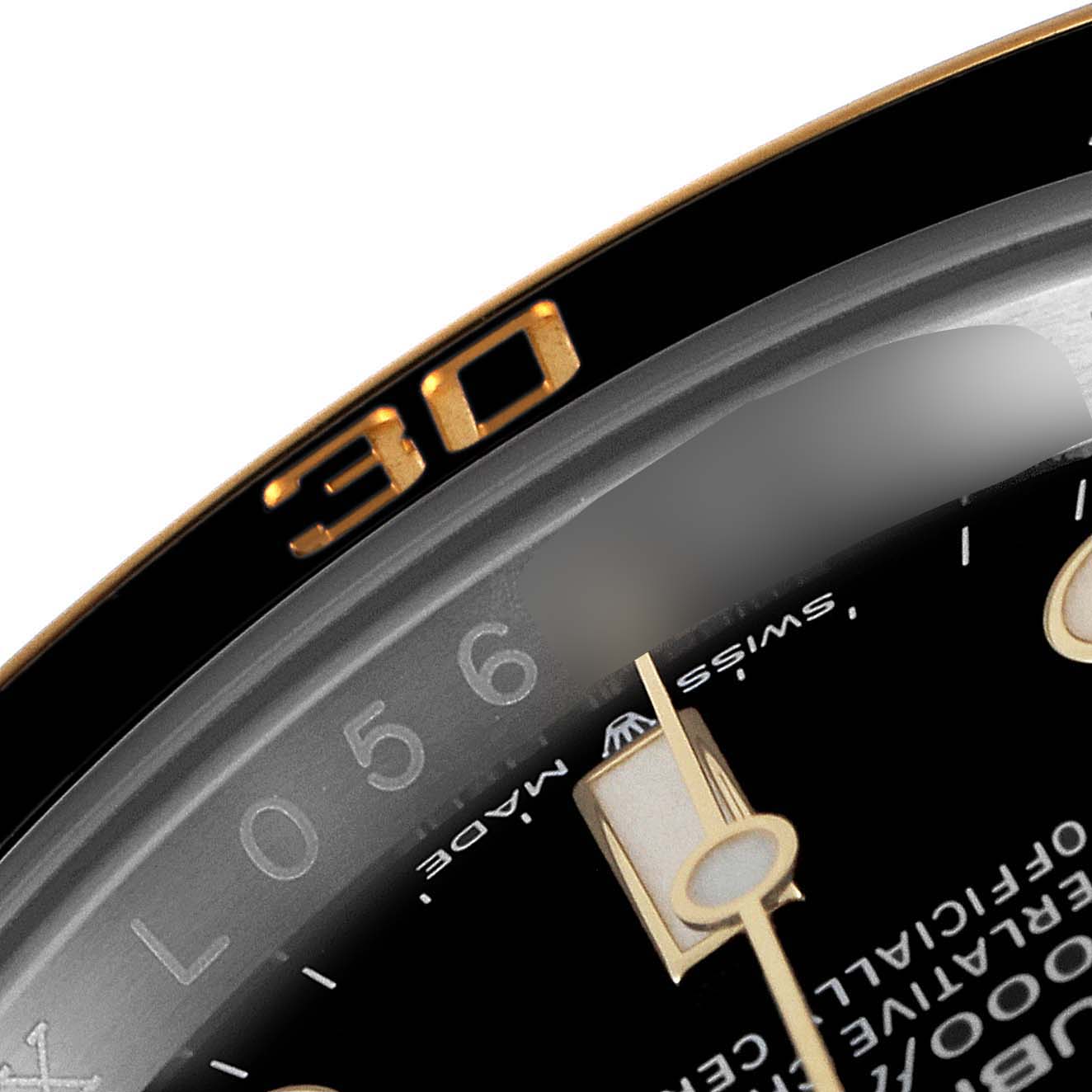 This close-up image shows part of the dial and bezel of a Rolex Submariner 126613 Men's Steel and Gold (two tone) Black Dial 126613 Men's Steel and Gold (two tone) Black Dial watch, focusing on the 30-minute marker.