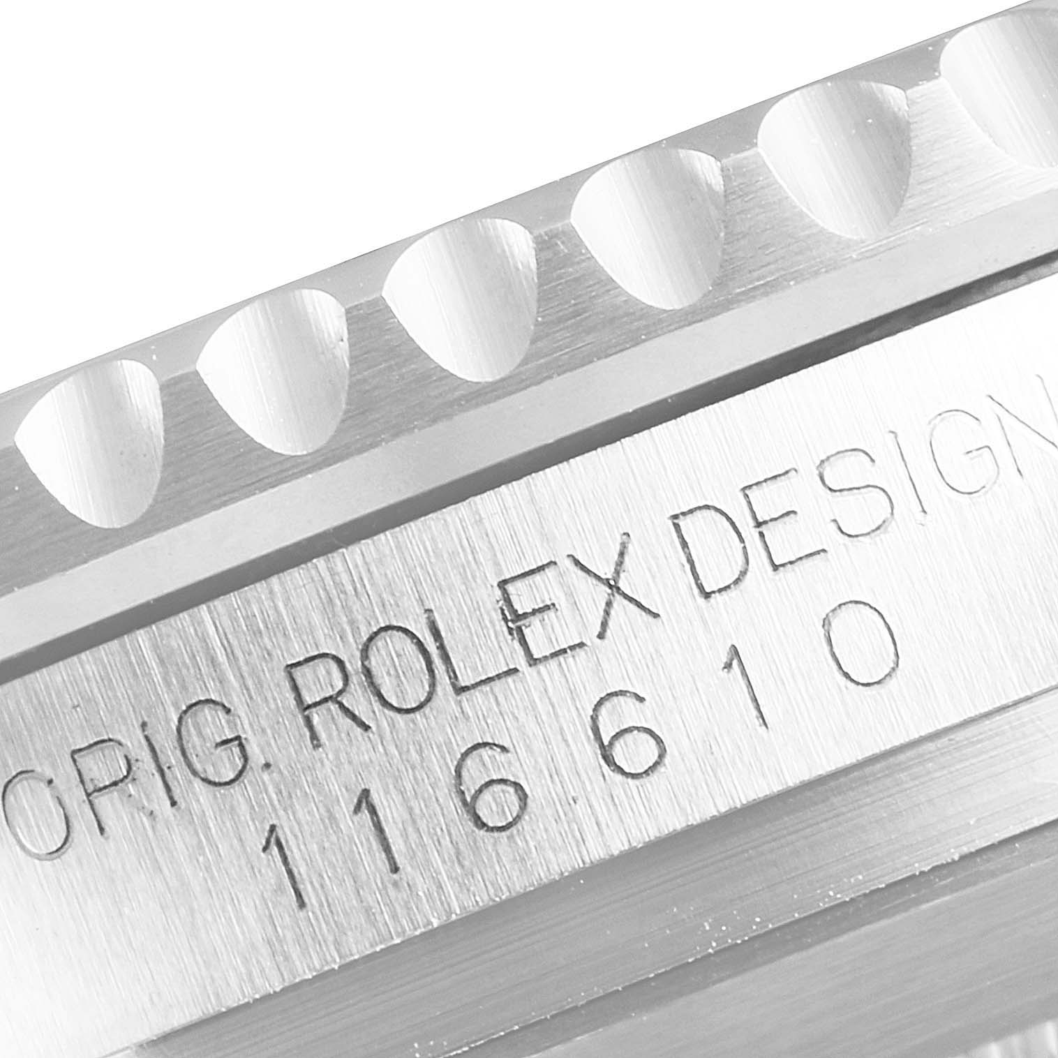 The image shows a close-up of the engraved case side of a Rolex Submariner 116610 Men
s Stainless Steel Black Dial 116610 Men
s Stainless Steel Black Dial, displaying "ORIG. ROLEX DESIGN 116610."