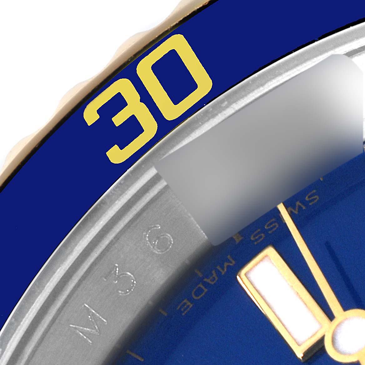 The close-up image shows part of the bezel, dial, and hands of a Rolex Submariner 16613 Men's Steel and Gold (two tone) Blue Dial 16613 Men's Steel and Gold (two tone) Blue Dial watch.