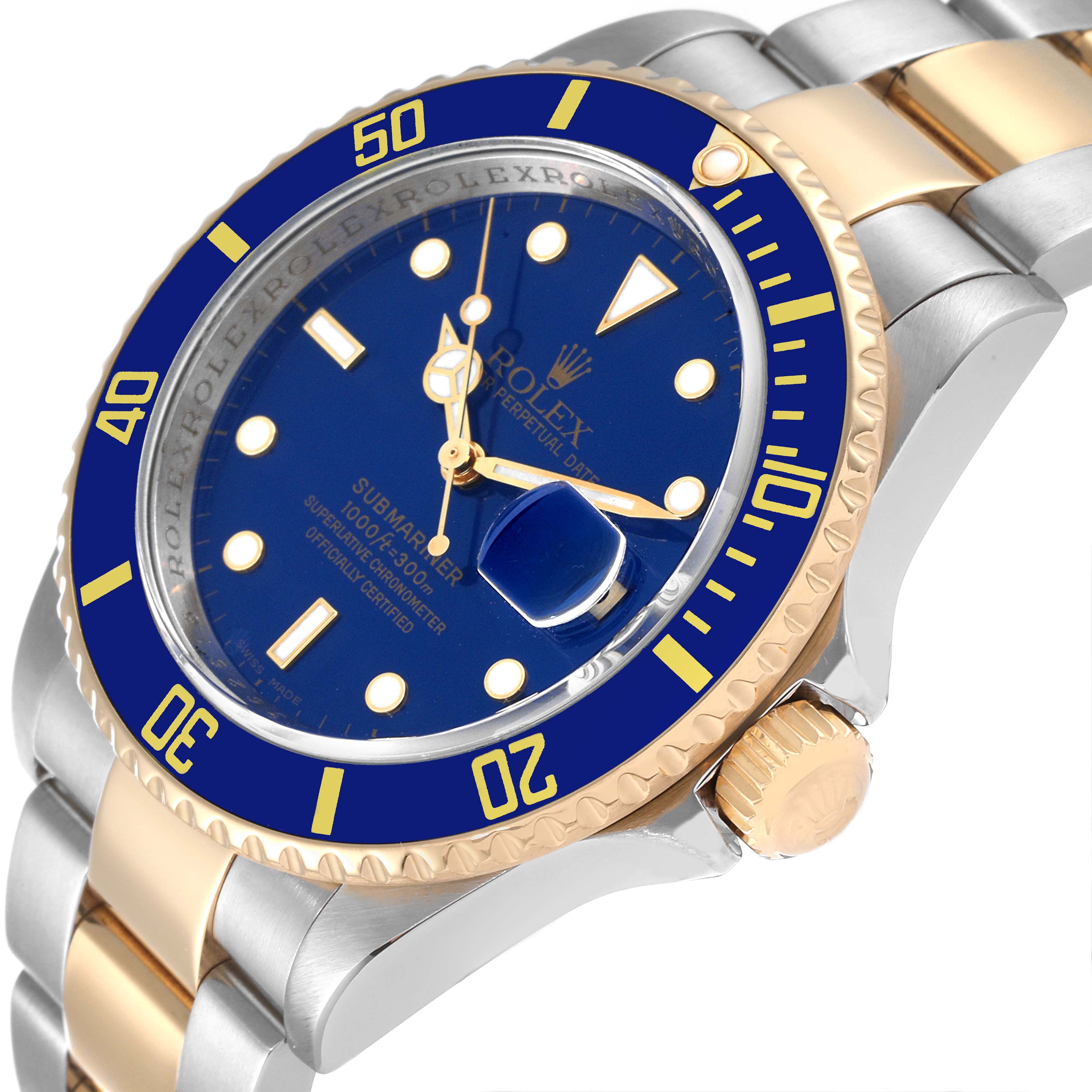 The image shows a close-up angle of a Rolex Submariner 16613 Men's Steel and Gold (two tone) Blue Dial 16613 Men's Steel and Gold (two tone) Blue Dial watch, highlighting its blue dial, bezel, crown, and two-tone bracelet.