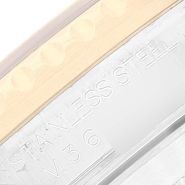 The image shows a close-up angled view of the Rolex Submariner 16613 Men's Steel and Gold (two tone) Blue Dial 16613 Men's Steel and Gold (two tone) Blue Dial's case, focusing on the engraved text "STAINLESS STEEL."