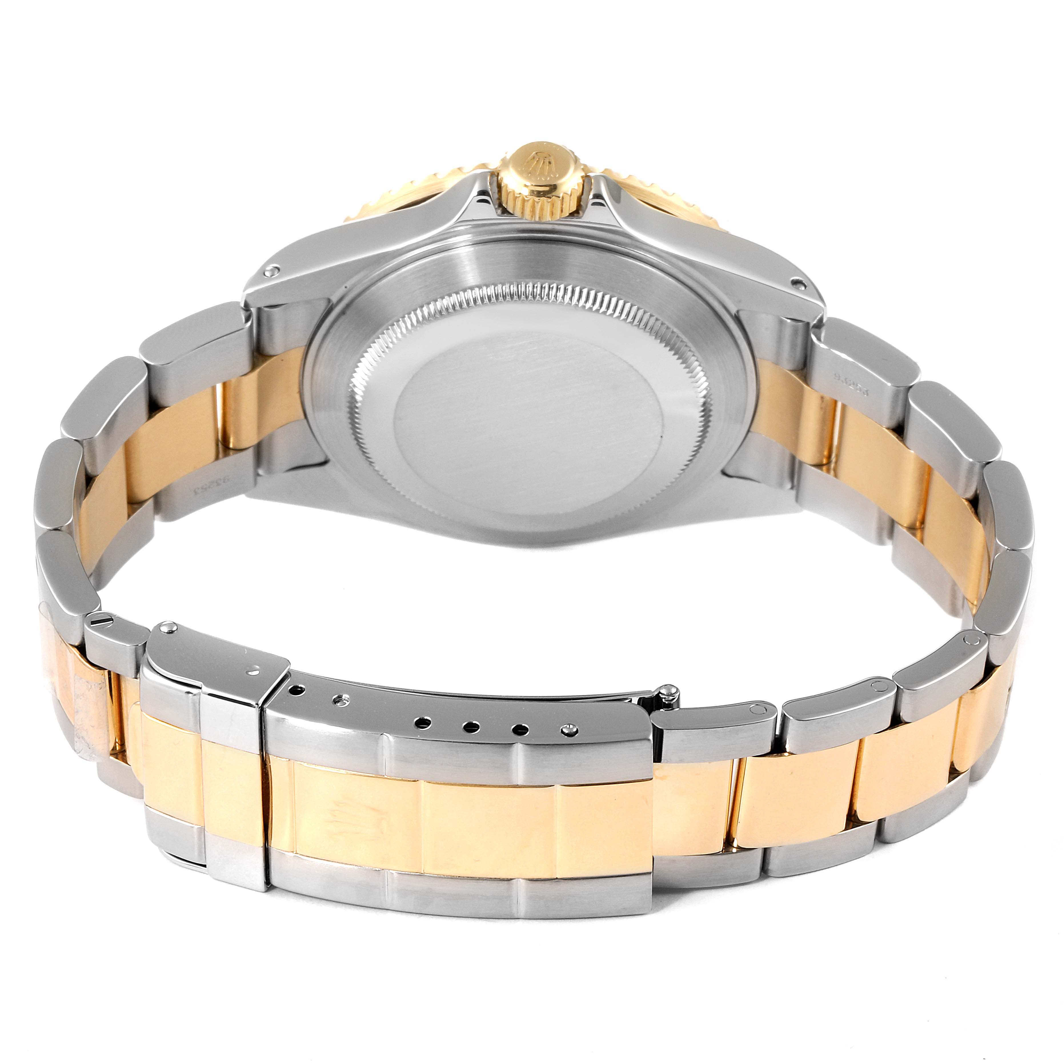 The image shows a Rolex Submariner 16613 Men's Steel and Gold (two tone) Blue Dial 16613 Men's Steel and Gold (two tone) Blue Dial watch from the back, highlighting its two-tone bracelet and case back.