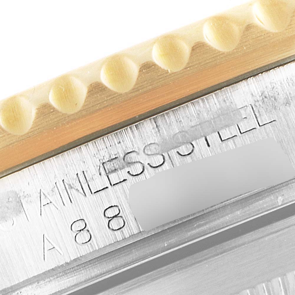 This close-up image shows the stainless steel and part of the bezel of a Rolex Submariner 16613 Men's Steel and Gold (two tone) Blue Dial 16613 Men's Steel and Gold (two tone) Blue Dial watch.