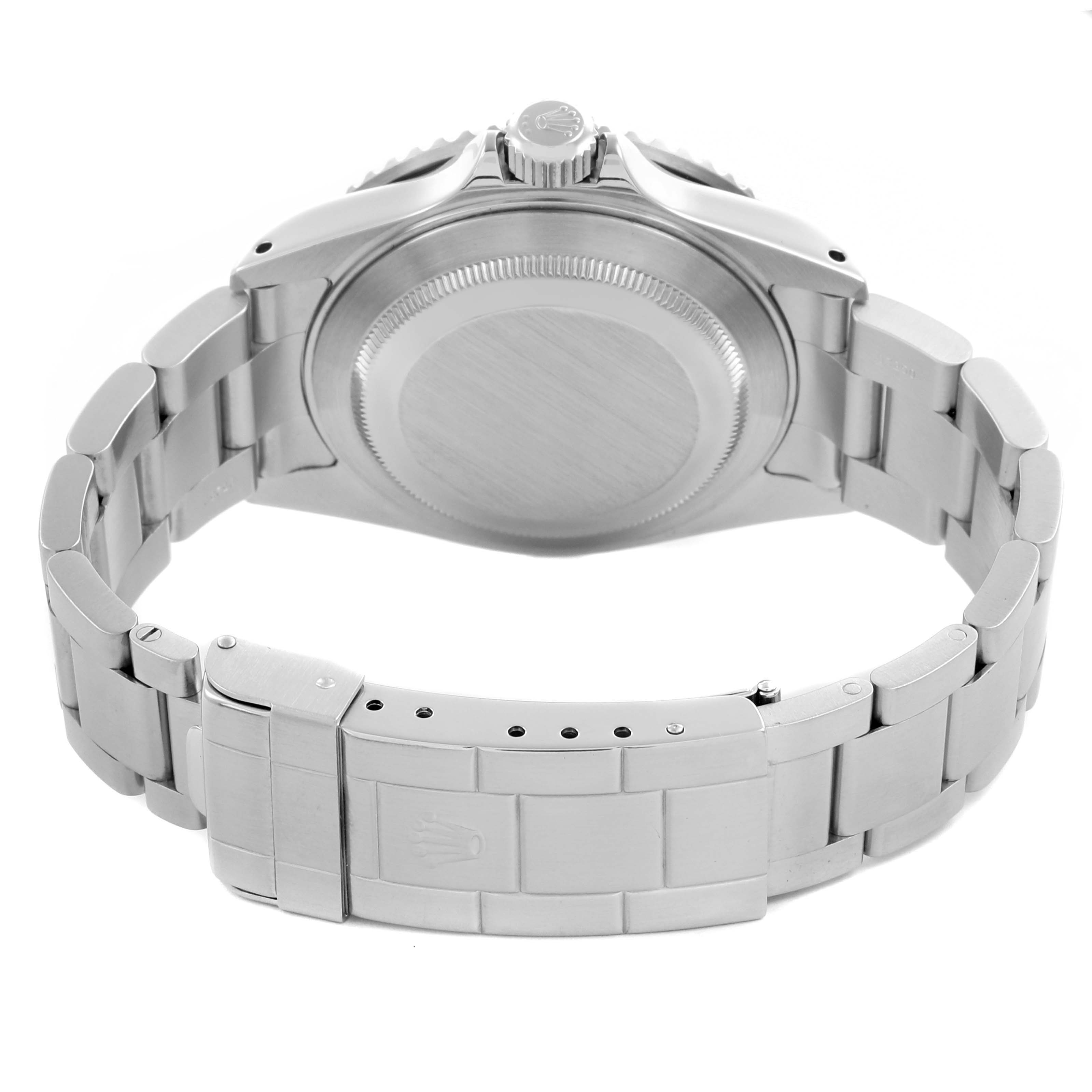 The image shows the back of the Rolex Submariner 16610 Men
s Stainless Steel Black Dial 16610 Men
s Stainless Steel Black Dial, focusing on the case back and stainless steel bracelet.