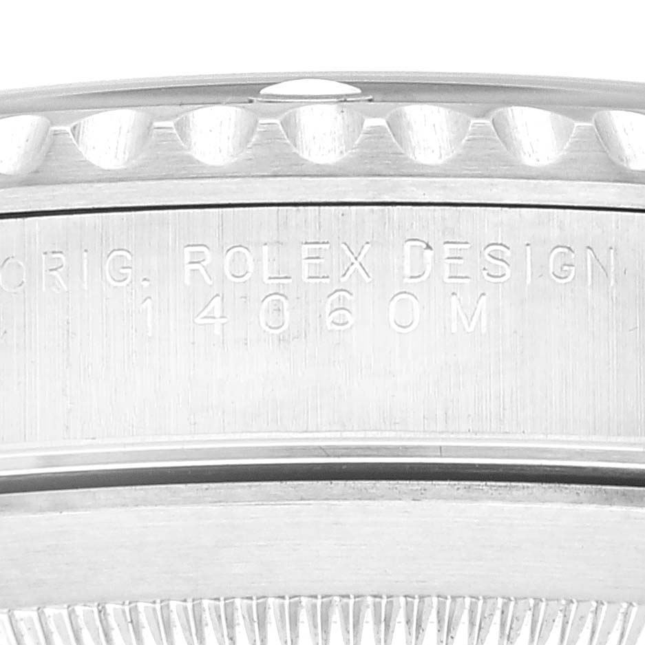 This image shows an engraved side profile of the bezel and case of a Rolex Submariner 14060 Men
s Stainless Steel Black Dial 14060 Men
s Stainless Steel Black Dial watch.