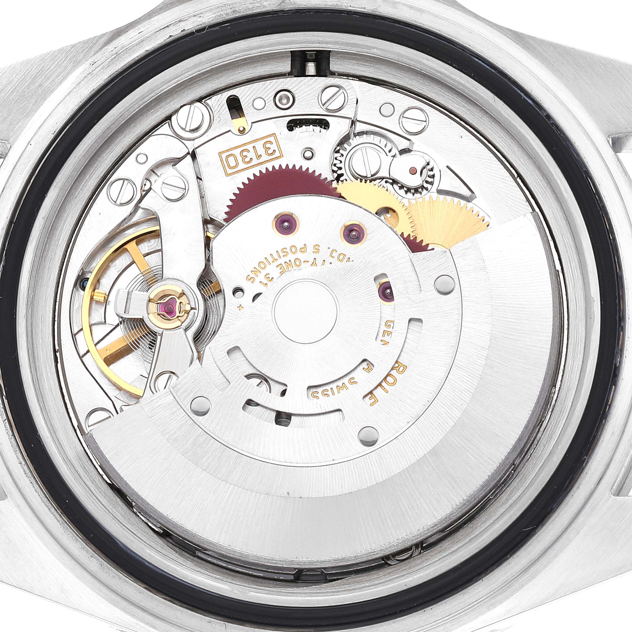 This image shows the open back of a Rolex Submariner 14060 Men
s Stainless Steel Black Dial 14060 Men
s Stainless Steel Black Dial, revealing its internal mechanical movement parts.