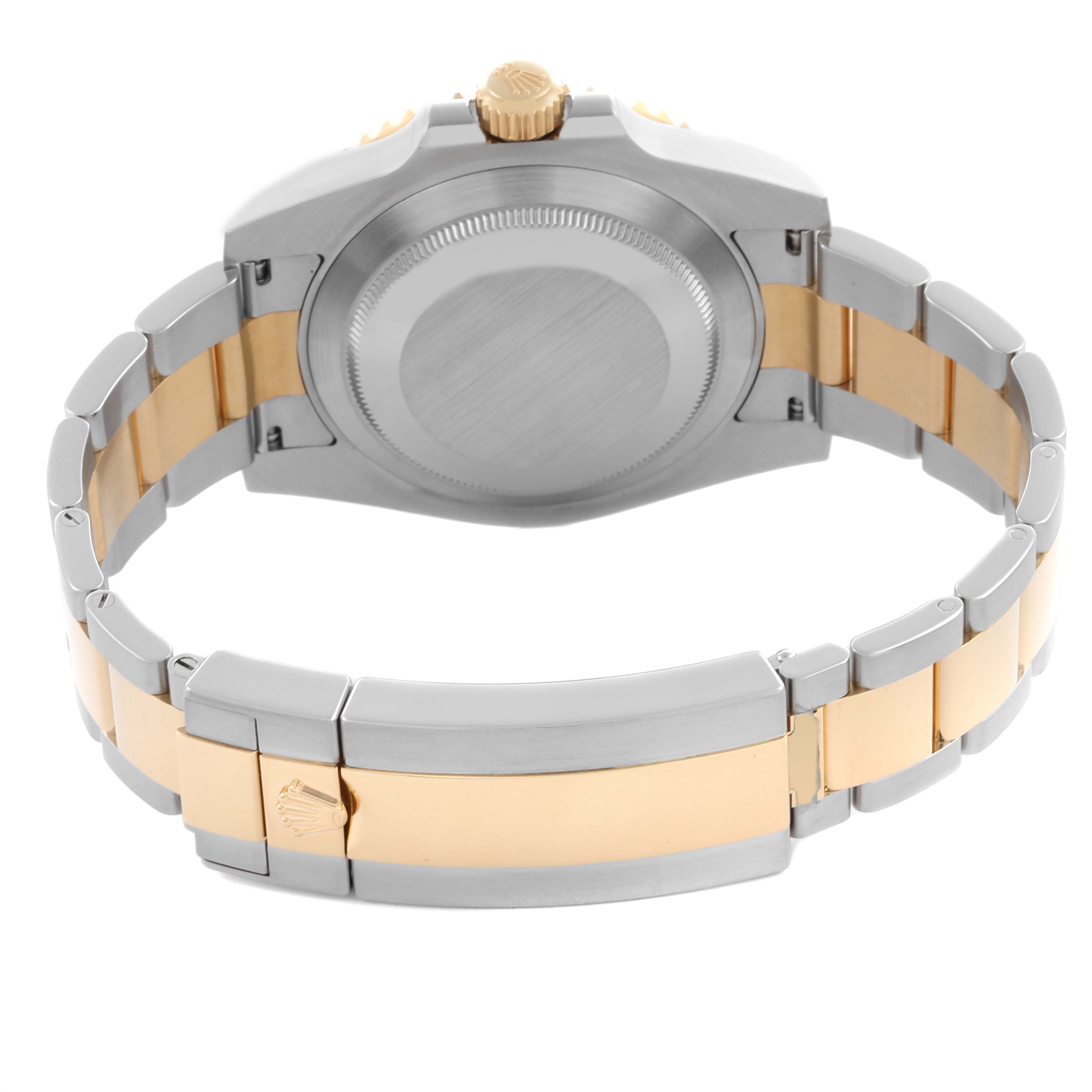 The image shows the back view of a Rolex Submariner 116613 Men's Steel and Gold (two tone) Black Dial 116613 Men's Steel and Gold (two tone) Black Dial, highlighting the case back, bracelet, and clasp with a two-tone design.