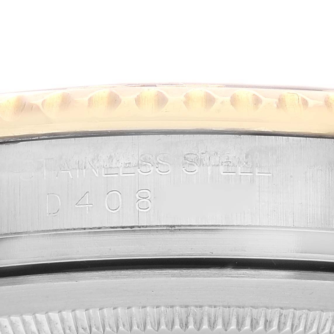 This image shows a close-up of the stainless steel case back and part of the bezel of a Rolex Yacht-Master 16623 Men
s Steel and Gold (two tone) Silver Dial 16623 Men
s Steel and Gold (two tone) Silver Dial watch.