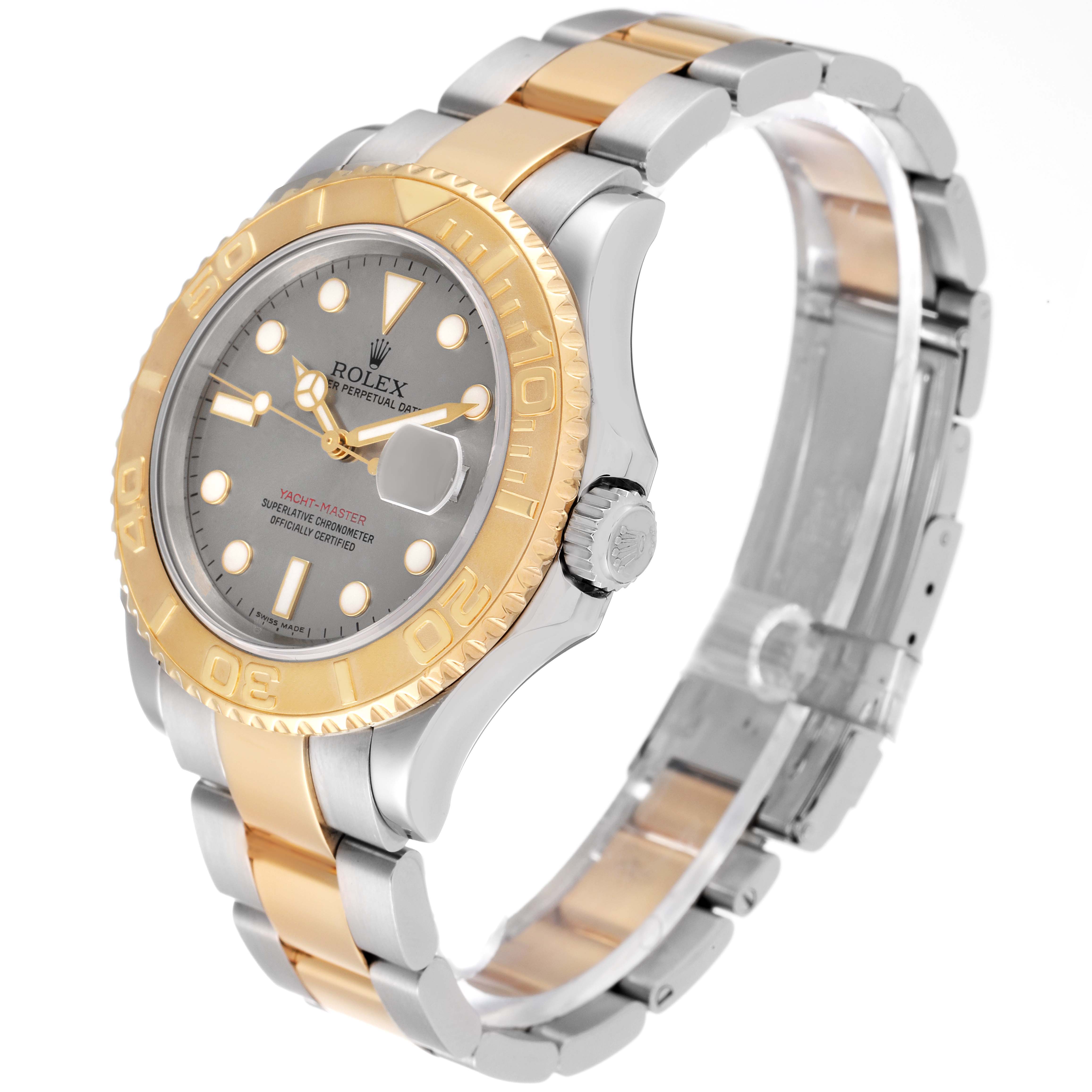 The Rolex Yacht-Master 16623 Men
s Steel and Gold (two tone) Silver Dial 16623 Men
s Steel and Gold (two tone) Silver Dial watch is shown at an angle, displaying its face, bezel, crown, and part of the bracelet.