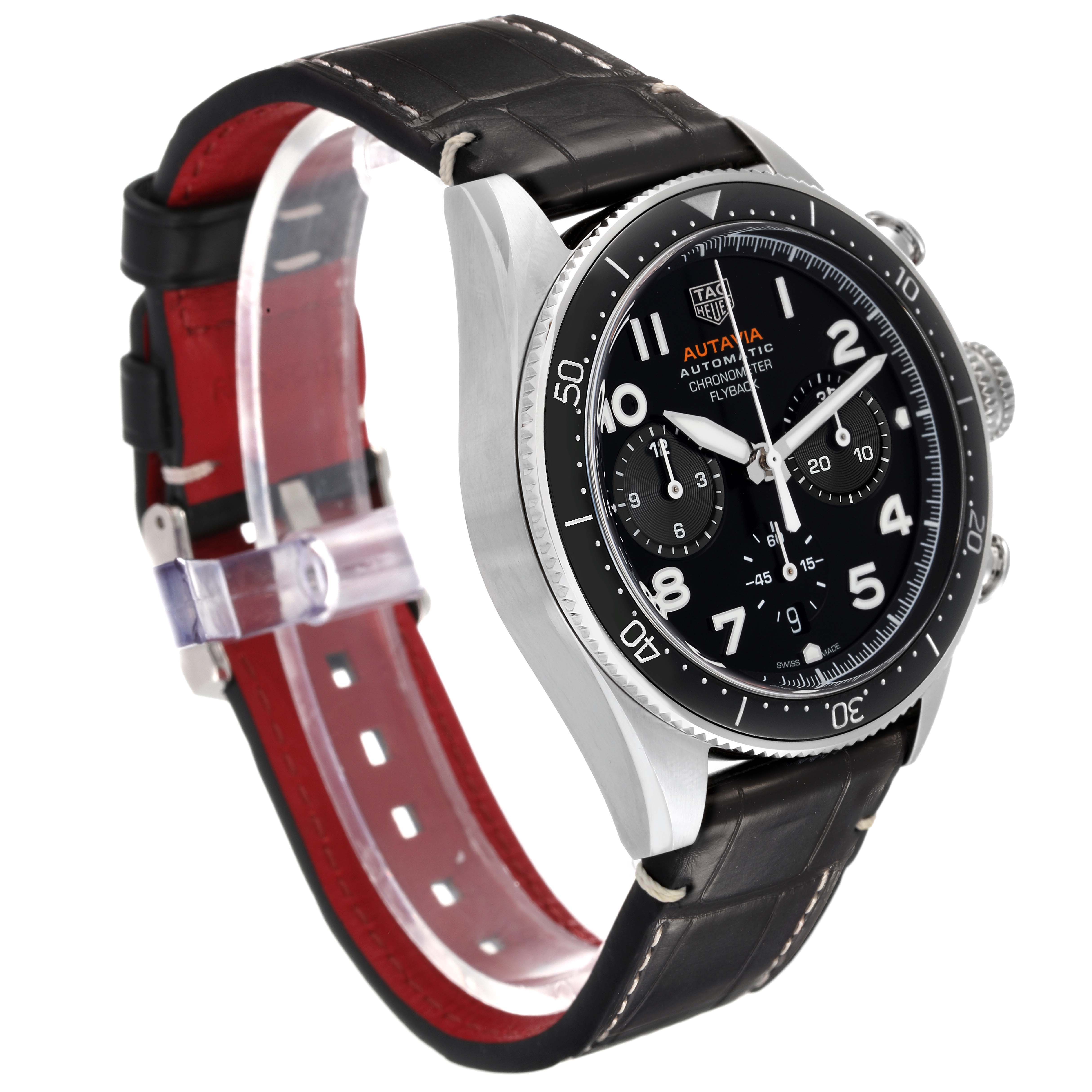 The image shows a Tag Heuer Autavia CBE511A.FC8279 Men's Stainless Steel Black Dial watch at a three-quarter angle, highlighting the face, bezel, crown, and leather strap.