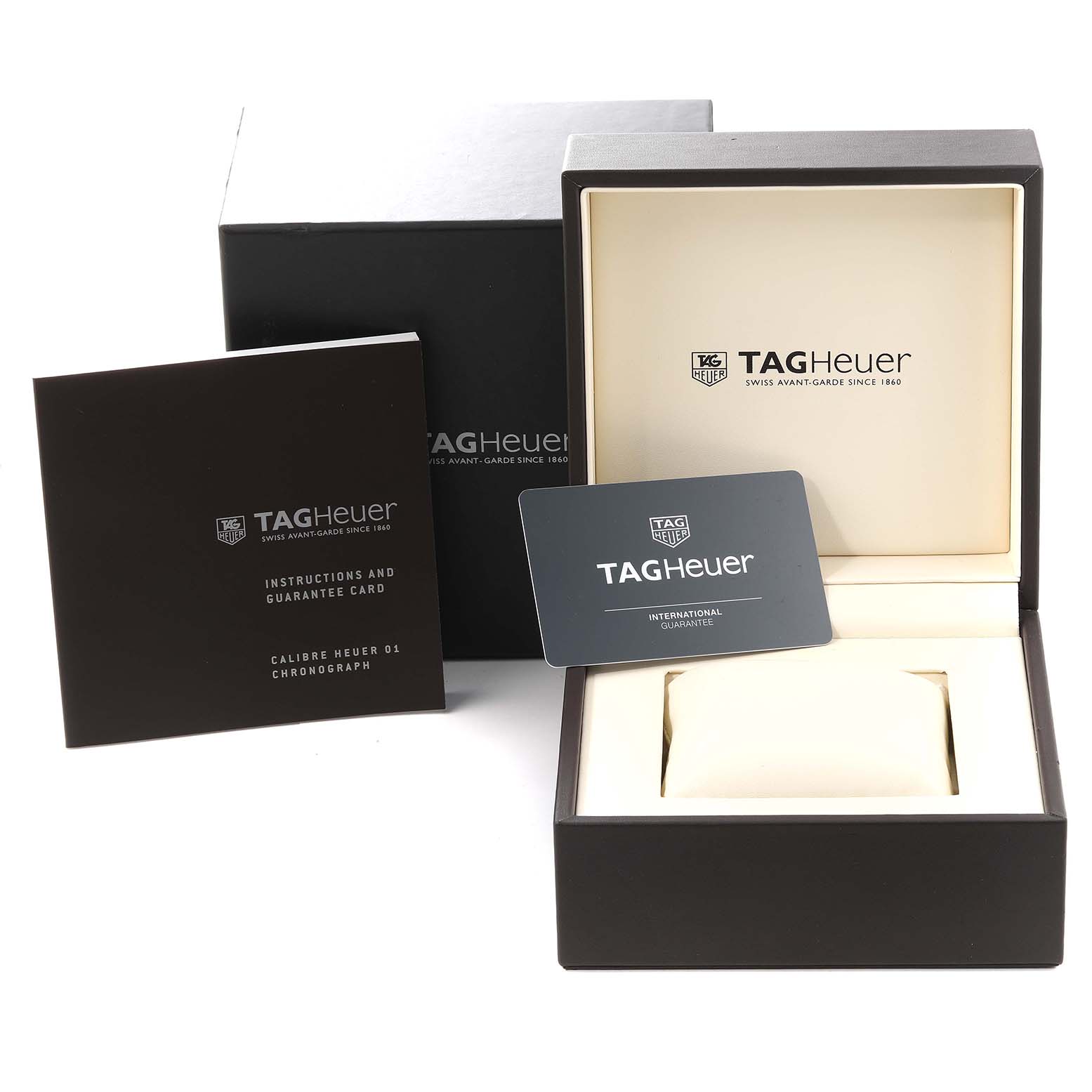 The image shows the packaging, instruction manual, and guarantee card for a Tag Heuer Carrera CAR2A1W Men
s Stainless Steel Transparent Dial CAR2A1W Men
s Stainless Steel Transparent Dial watch.