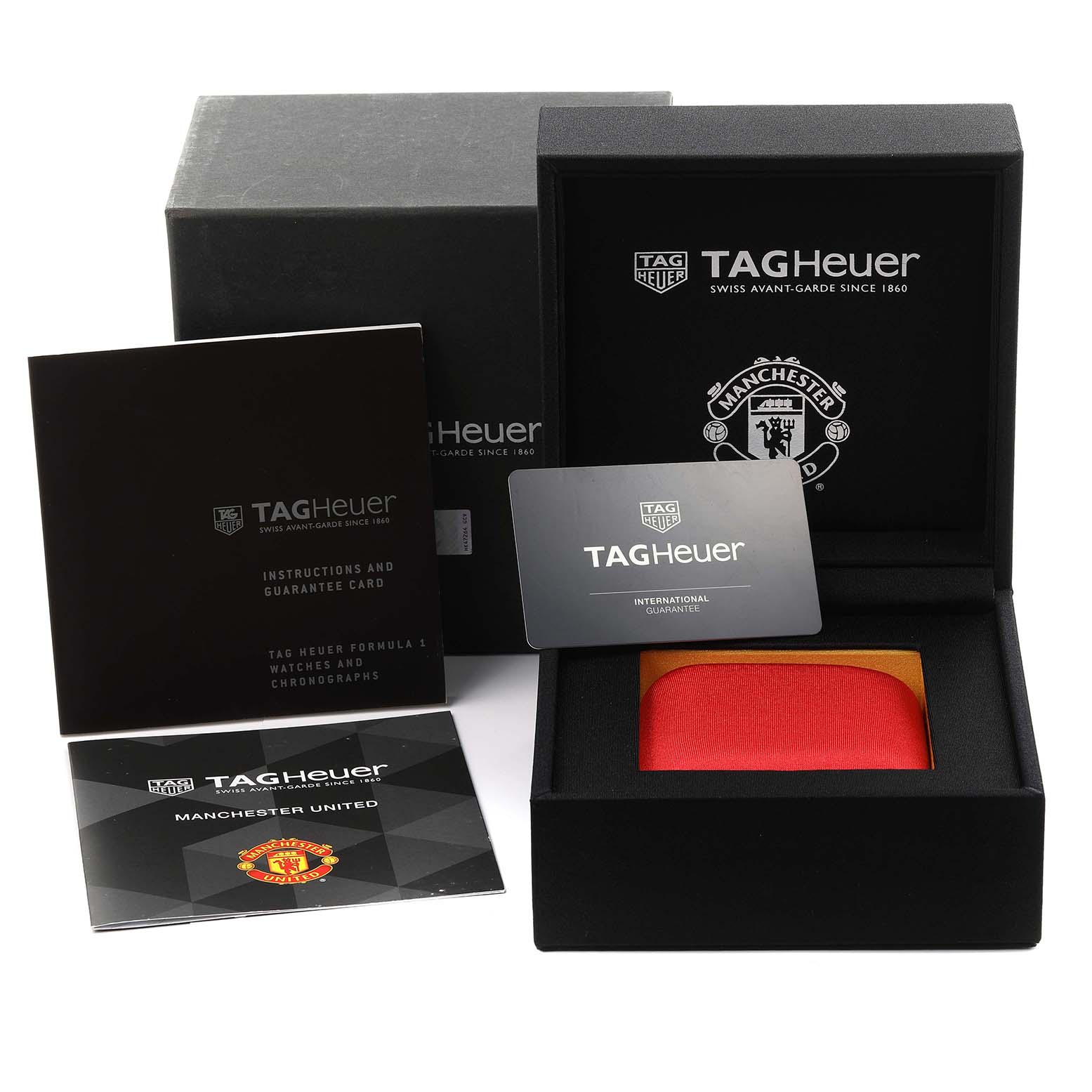 The image shows the packaging and accessories for a Tag Heuer Formula 1 CAZ101J.FC8027 Men's Stainless Steel Black Dial CAZ101J.FC8027 Men's Stainless Steel Black Dial watch, including a box, cards, and booklets.