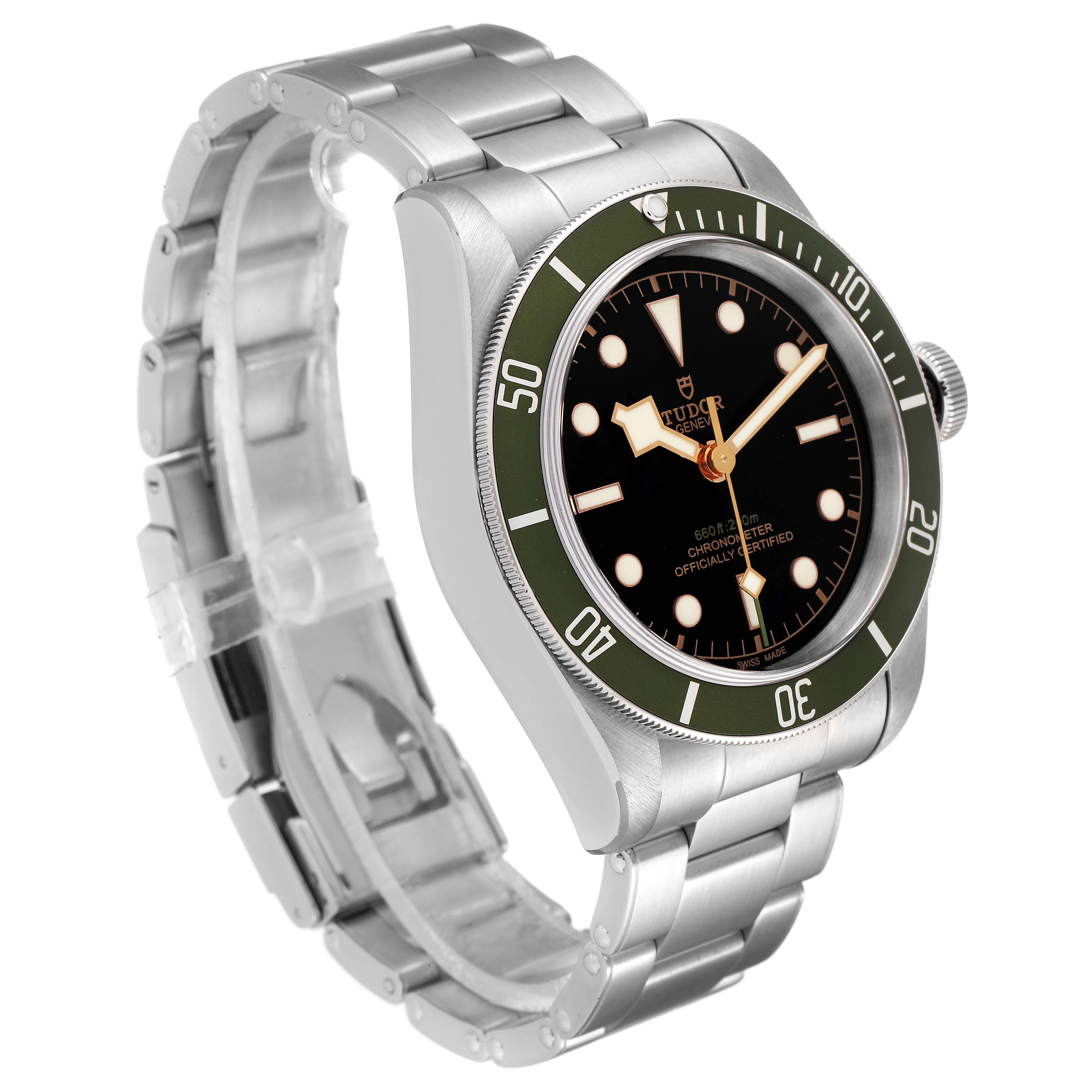 The image displays a Heritage Black Bay model by Tudor at a three-quarter angle, showcasing the watch face, bezel, crown, and bracelet.