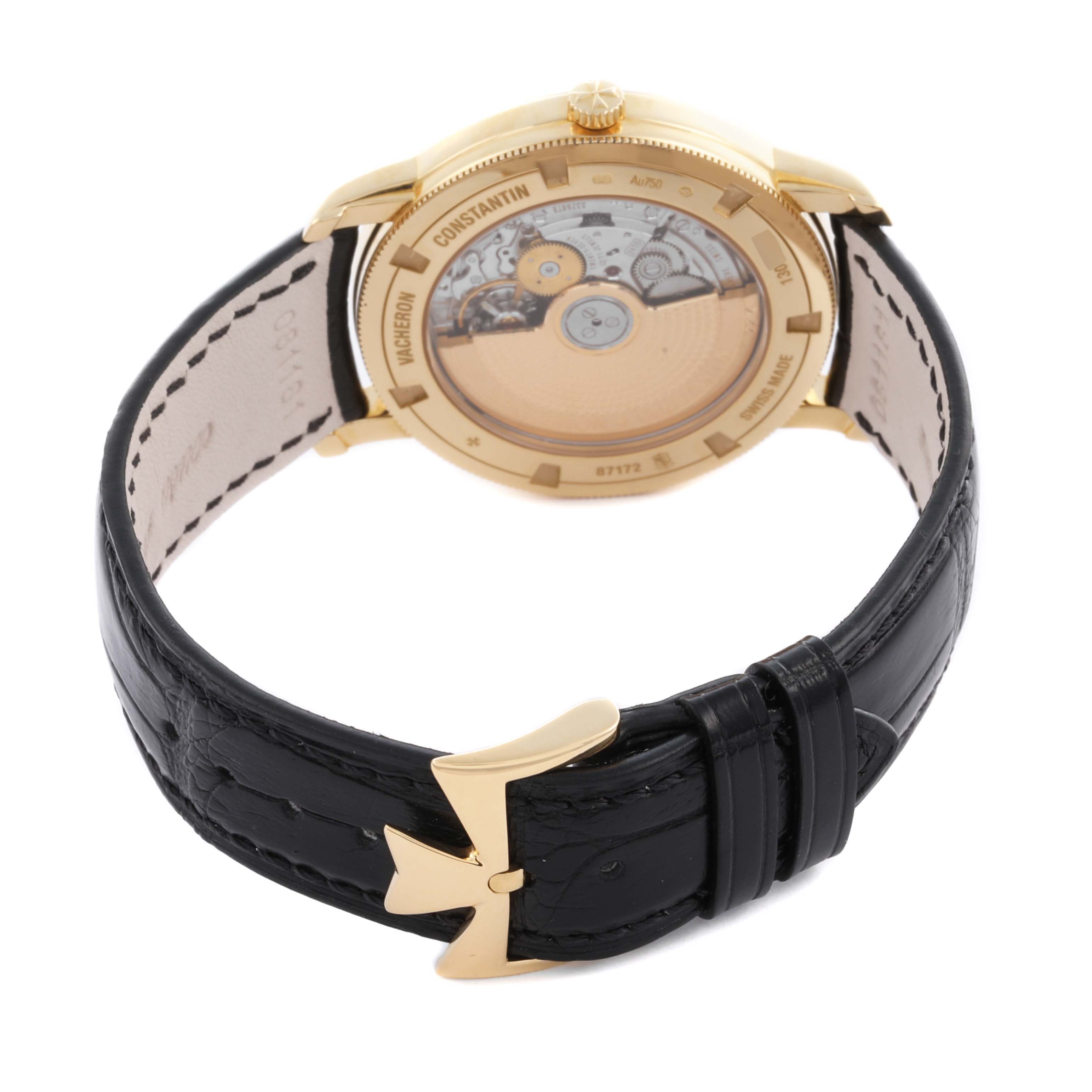 The image shows the back of a Vacheron Constantin Traditionnelle 87172/000J-9512 Men's Yellow Gold Silver Dial watch, highlighting its movement and black leather strap.