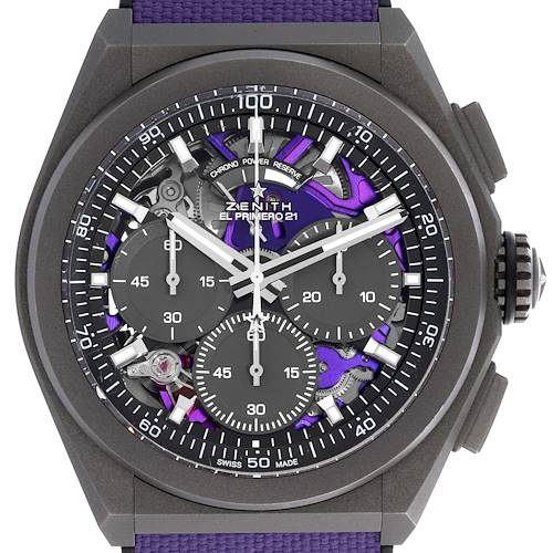 The Zenith Defy watch is shown from the front, highlighting the intricate dial, chronograph subdials, and crown.