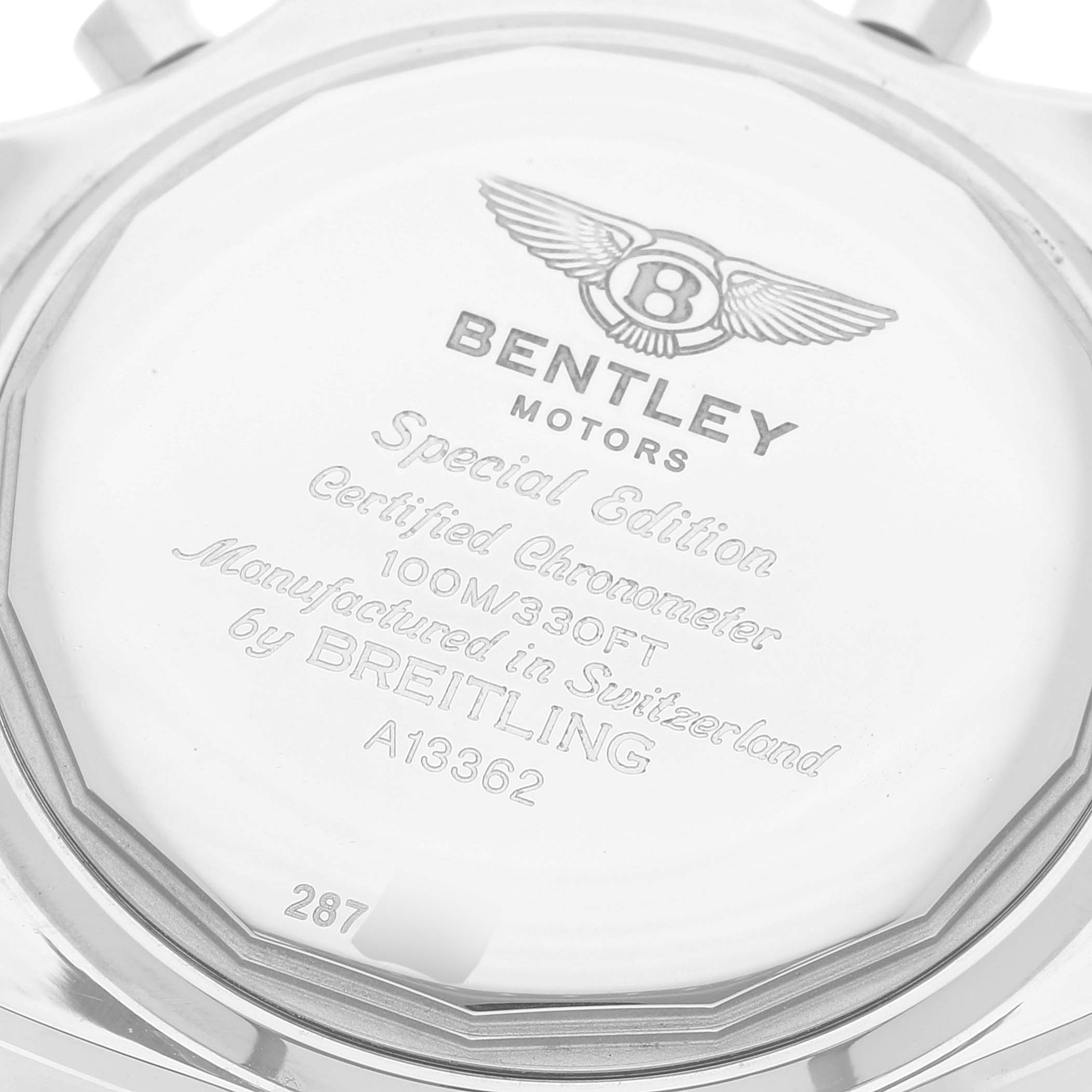 The image shows the back case of a Bentley model watch by Breitling, showcasing the engravings and model information.