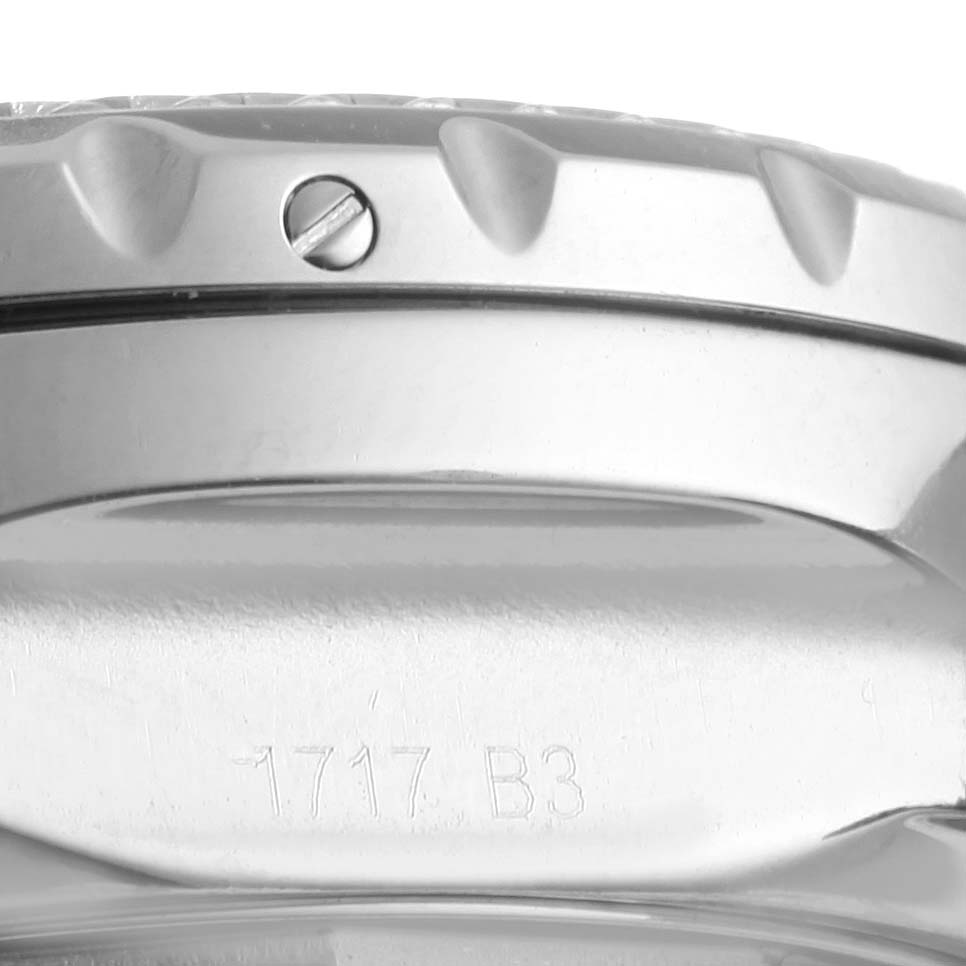 This image shows a close-up of the side of the case, bezel, and serial number of a Bentley model by Breitling.