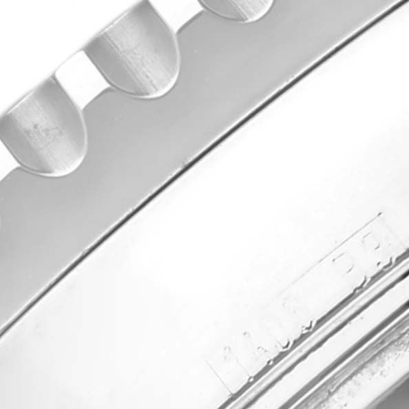 This image shows a close-up of the edge of the bezel on a Breitling Navitimer A23322 Men
s Stainless Steel Blue Dial A23322 Men
s Stainless Steel Blue Dial watch.