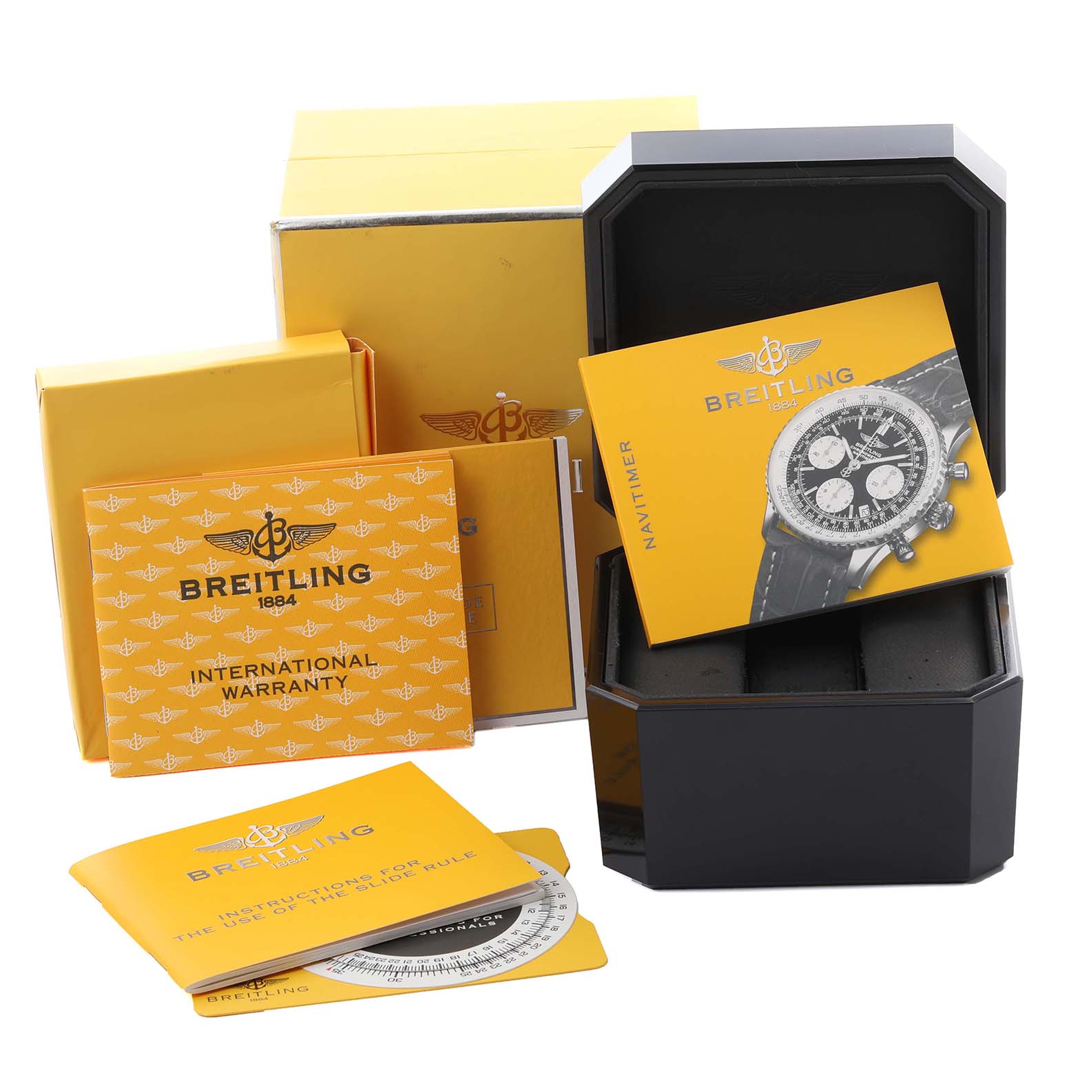 This image shows the packaging and accessories for a Breitling Navitimer A23322 Men
s Stainless Steel Blue Dial A23322 Men
s Stainless Steel Blue Dial, including booklets and an open watch box.