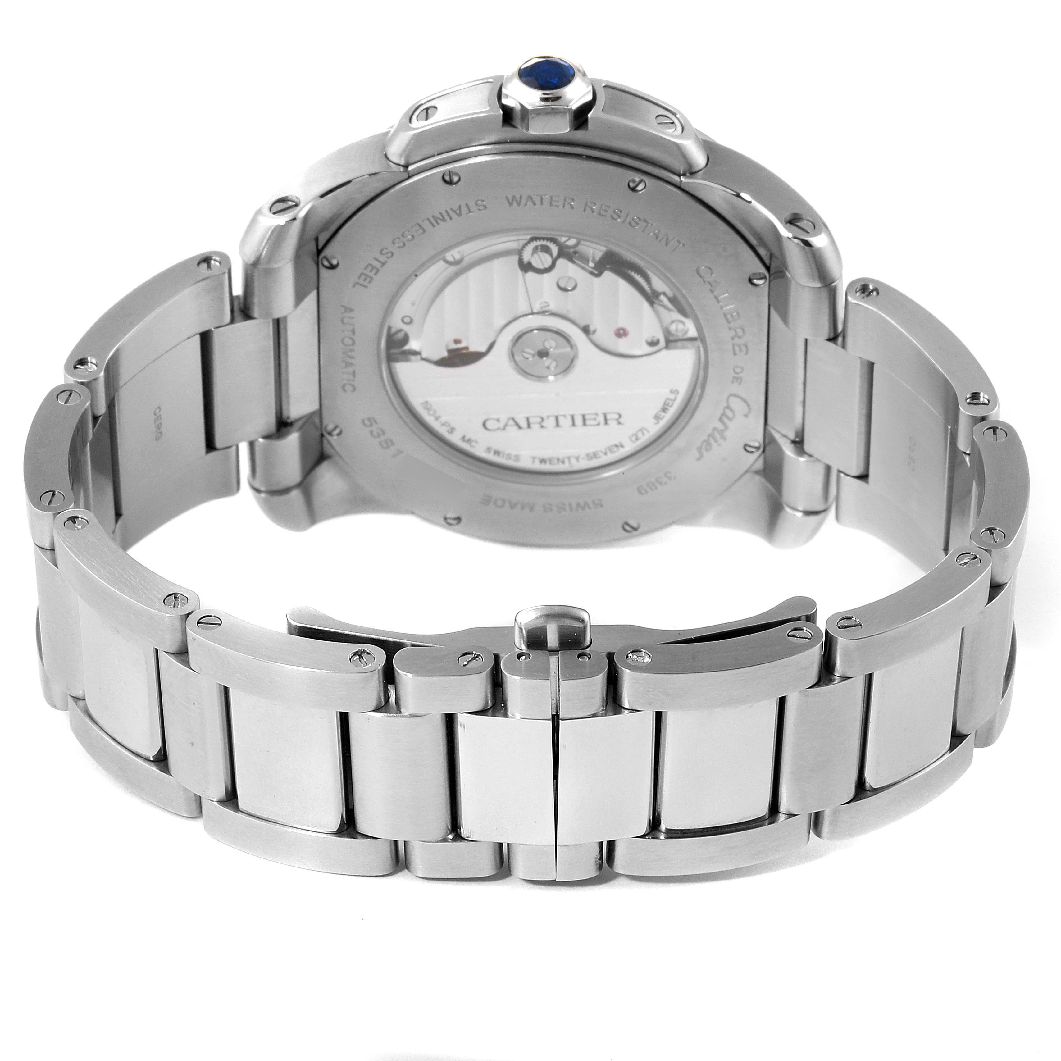 The image shows the back view of the Calibre de Cartier watch by Cartier, featuring its stainless steel bracelet and the watch
s internal mechanism.