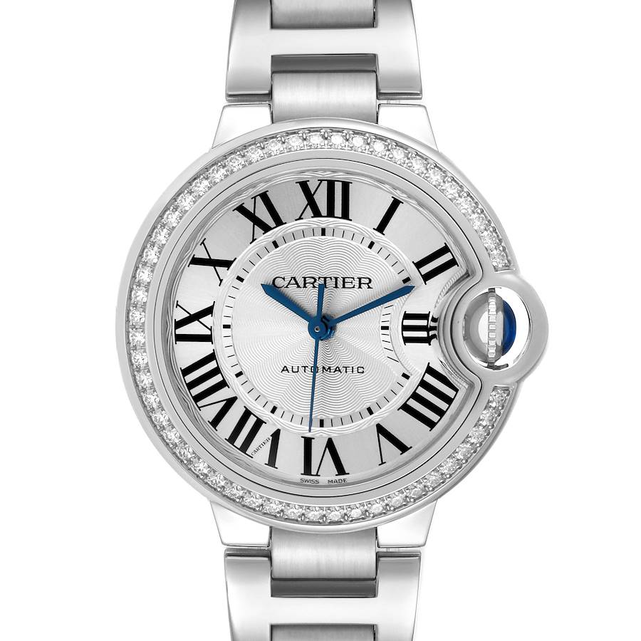 The Cartier Ballon Bleu watch is shown from the front, highlighting its face, Roman numerals, and diamond-set bezel.