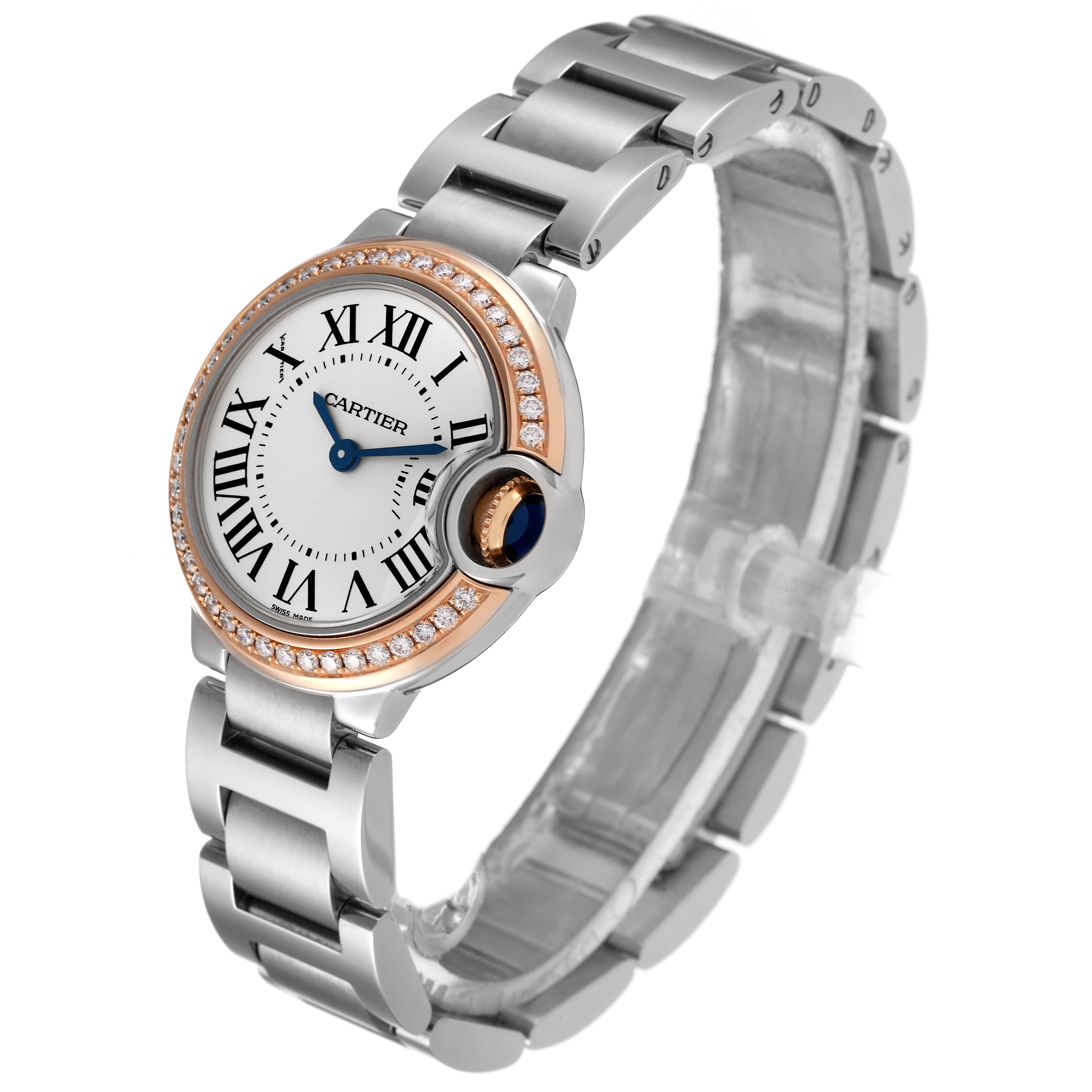 The Ballon Bleu de Cartier watch is shown at a slight angle, displaying the face, bezel, and metal bracelet.