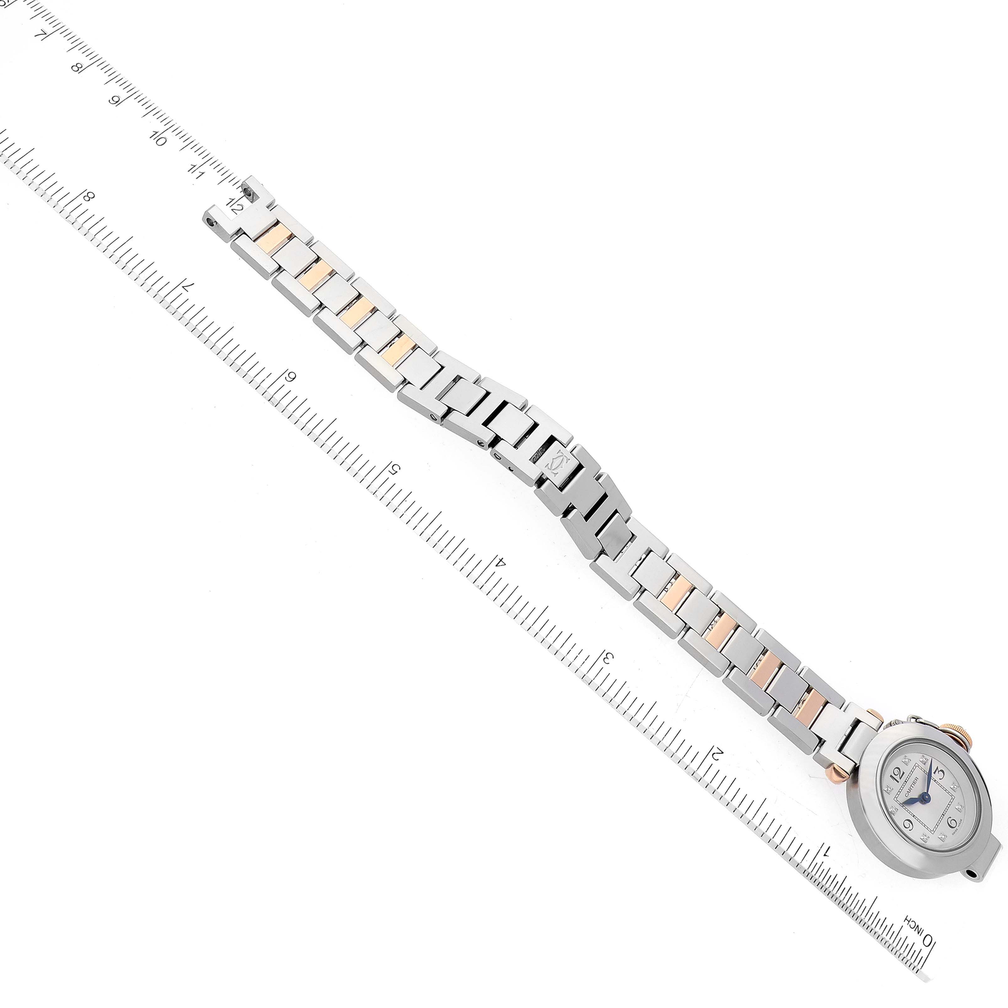 The image shows a Cartier Pasha WJ124020 Women's Steel and Gold (two tone) Silver Dial WJ124020 Women's Steel and Gold (two tone) Silver Dial watch laid flat with a ruler beside it, highlighting its length.