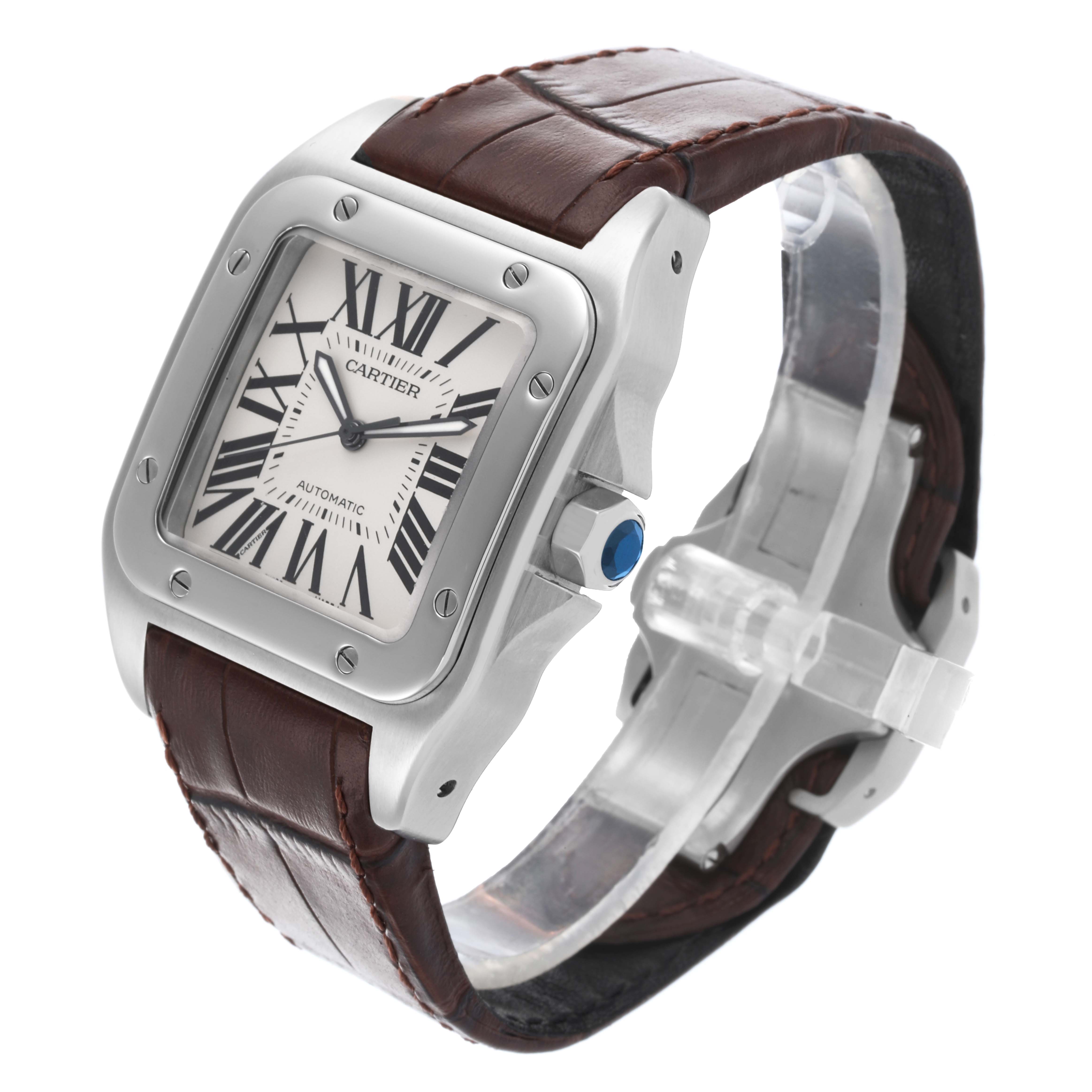 The Cartier Santos W20073X8 Men
s Stainless Steel Silver Dial W20073X8 Men
s Stainless Steel Silver Dial watch is shown at a three-quarter angle, displaying its face, crown, bezel, and leather strap.